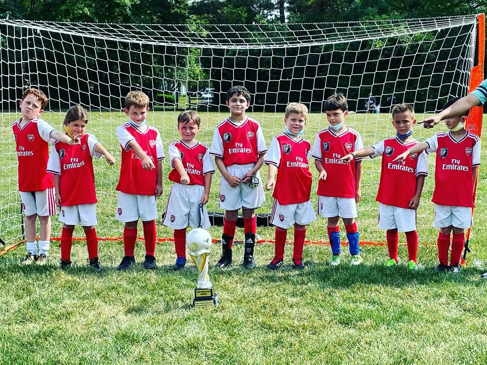 a group of football players posing for a photo