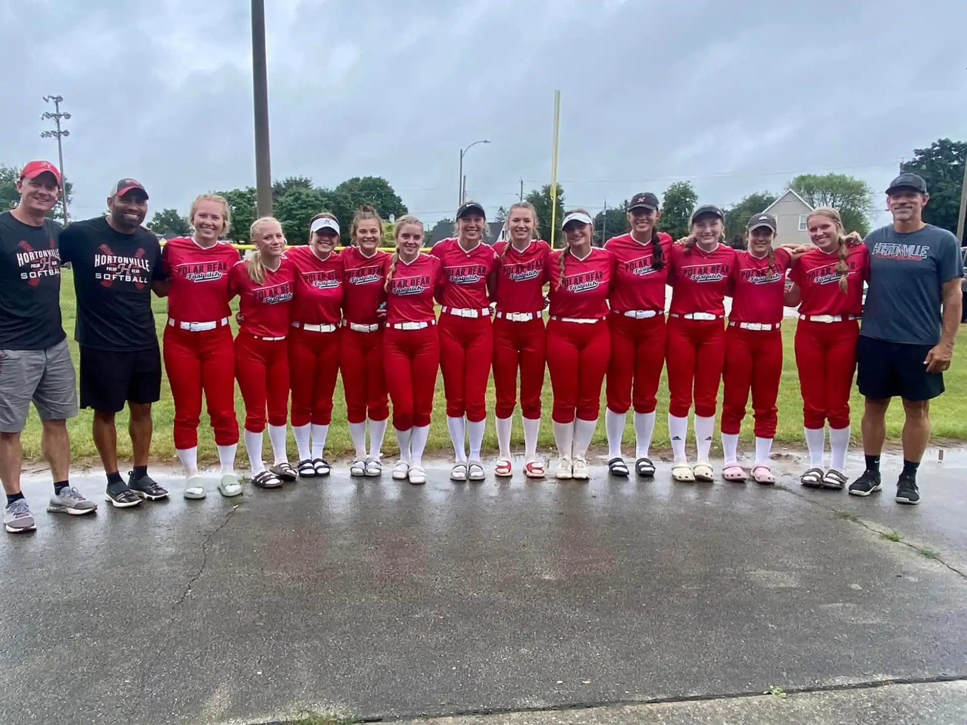 a group of people in red uniforms