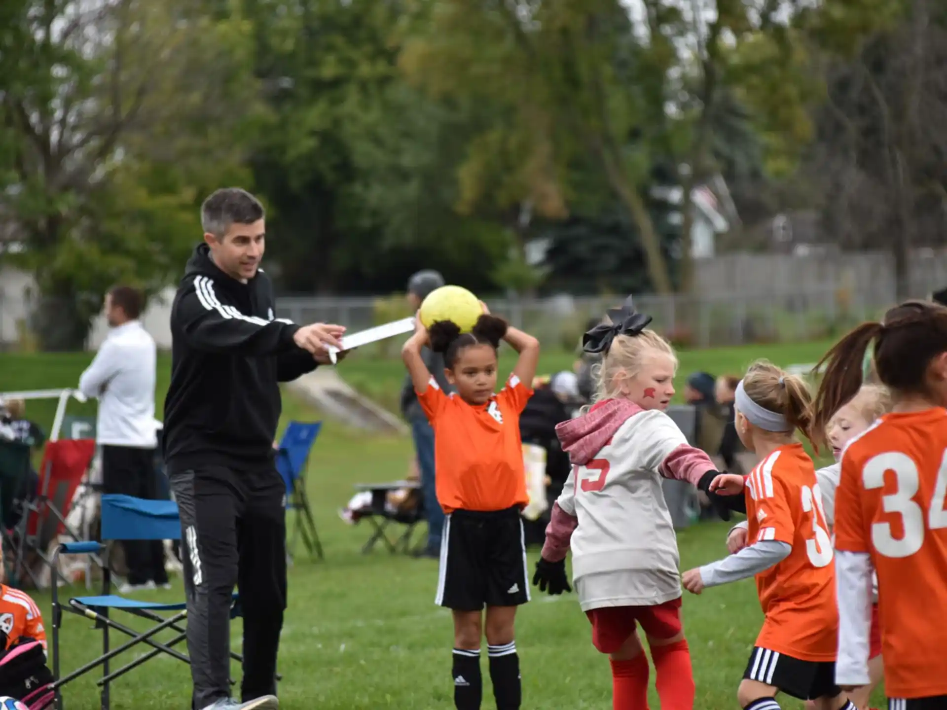 a person talking to a group of kids