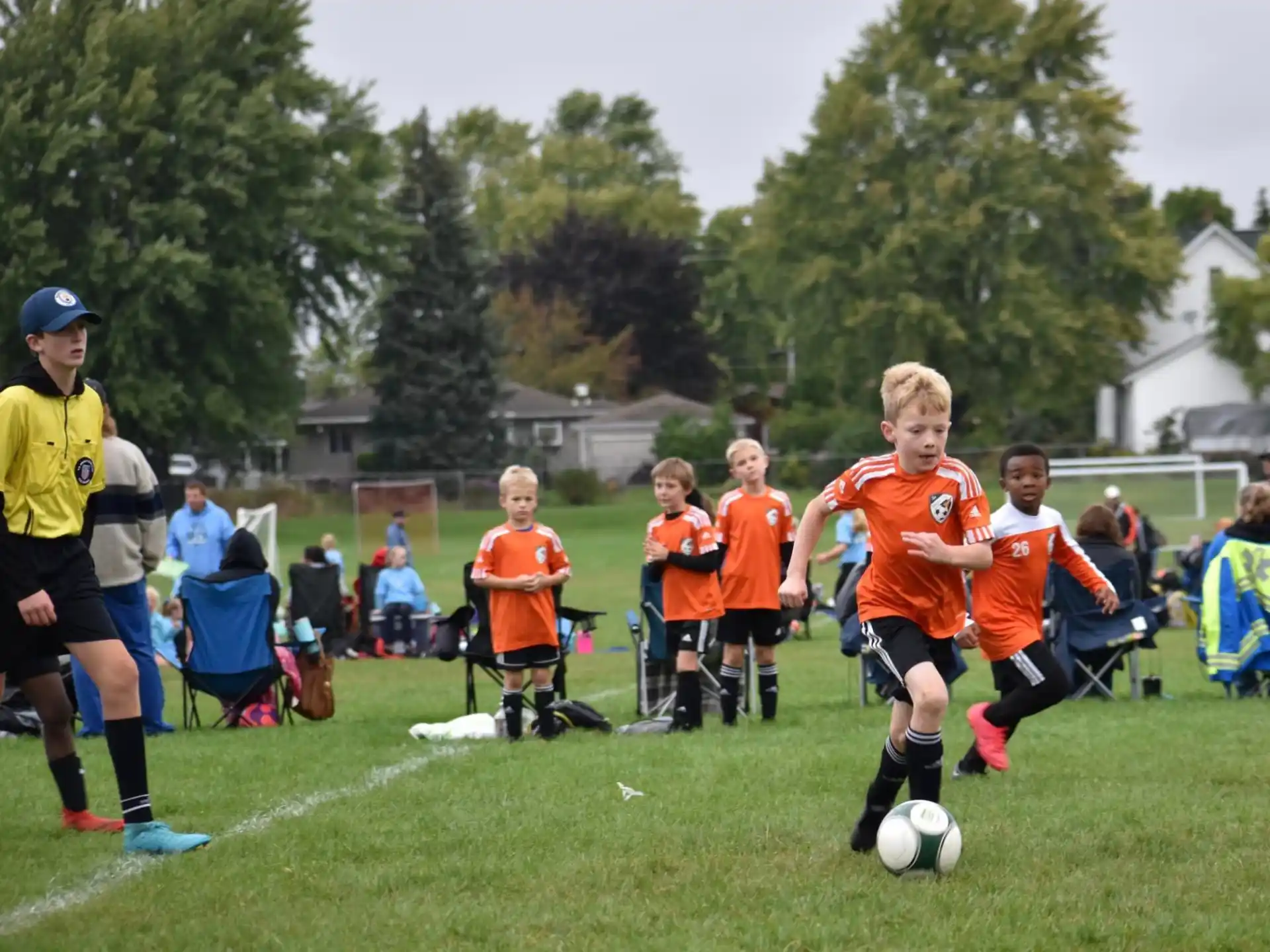 kids playing football on a field
