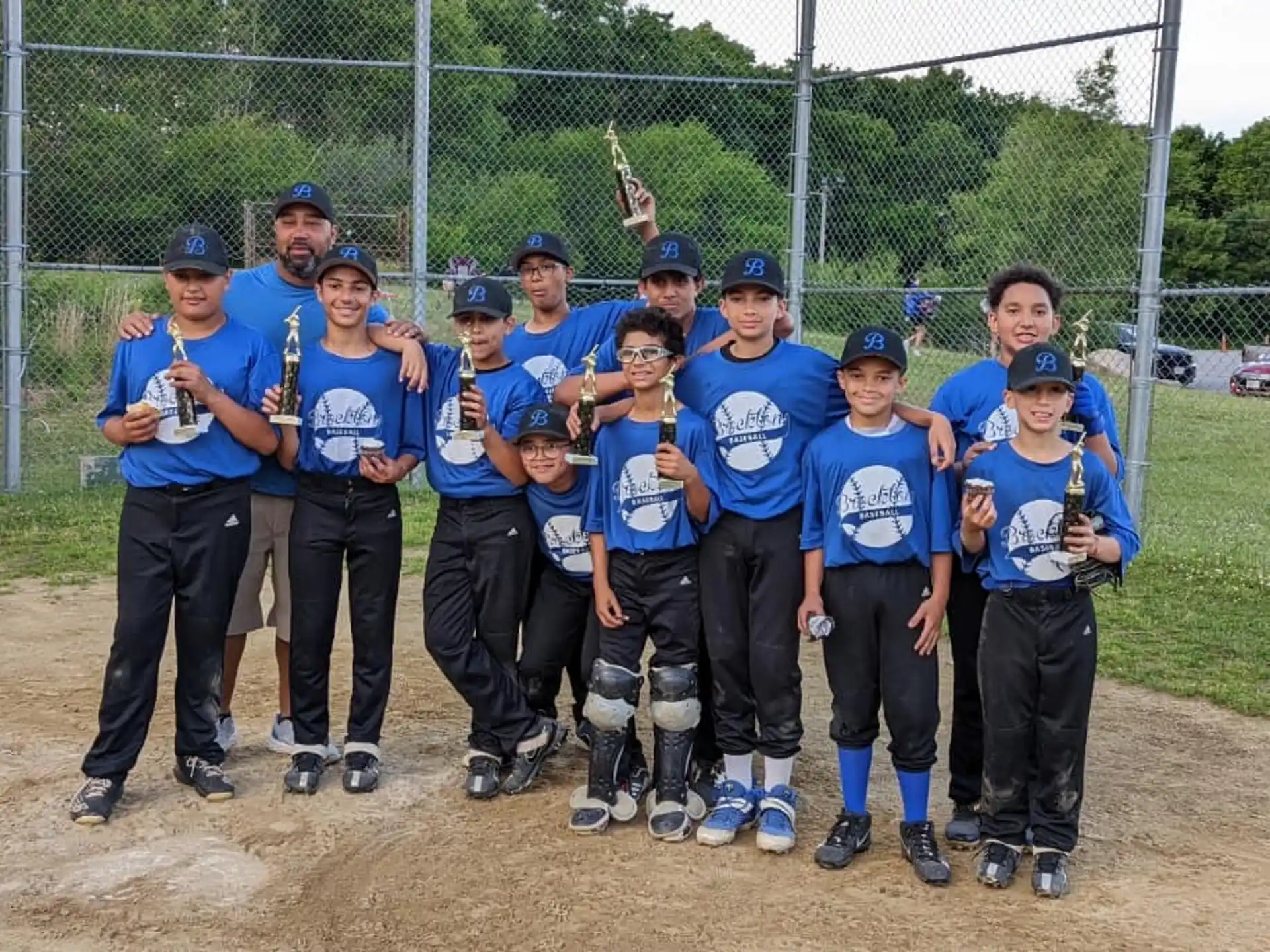 a group of people wearing baseball uniforms