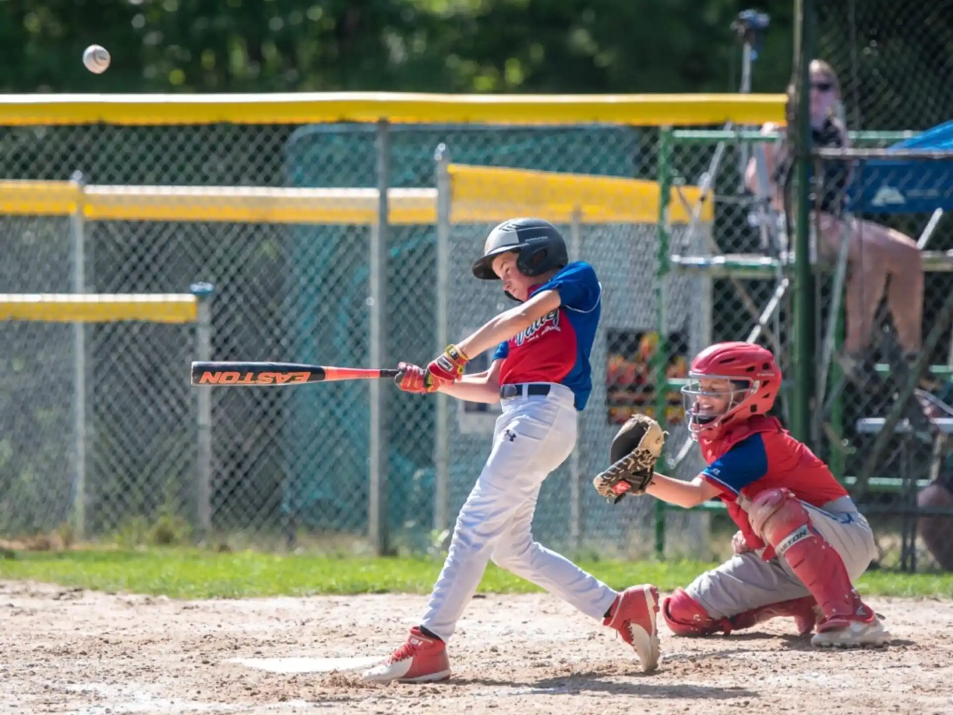 a baseball player swinging a bat
