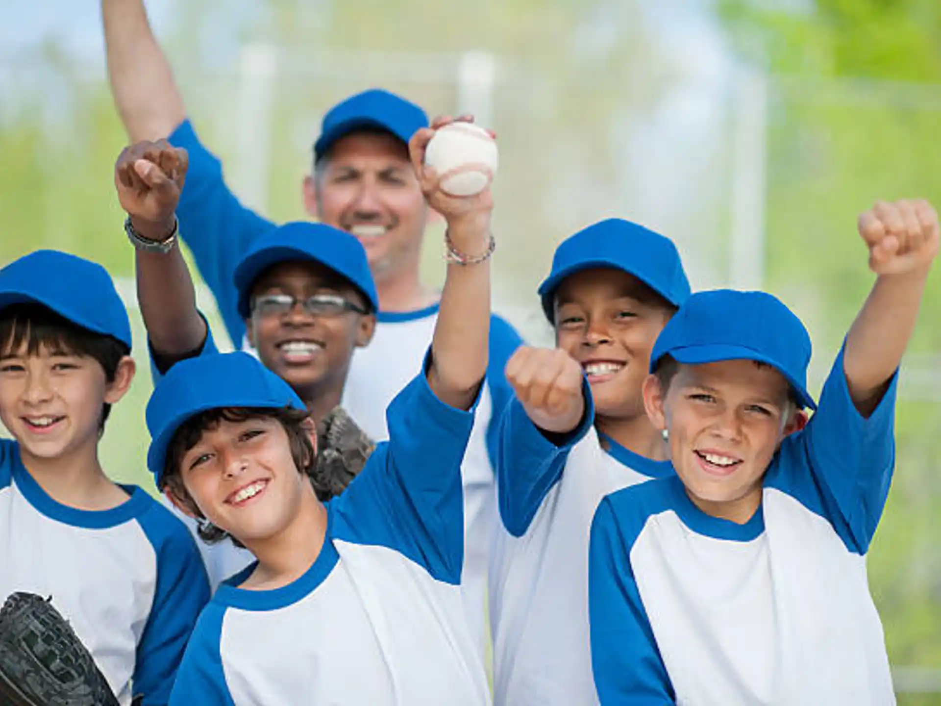 a group of people wearing baseball uniforms
