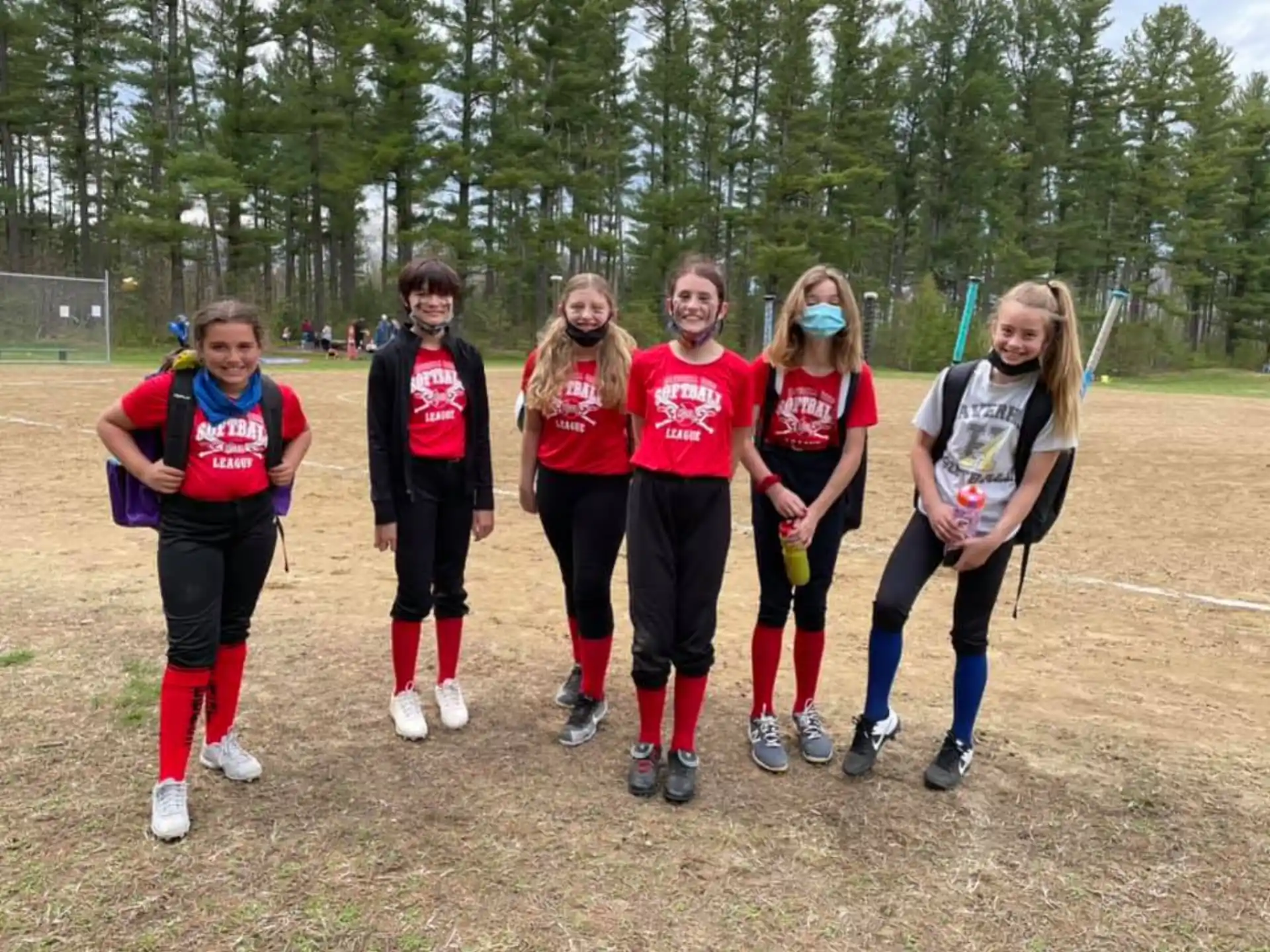 a group of girls in sports uniforms