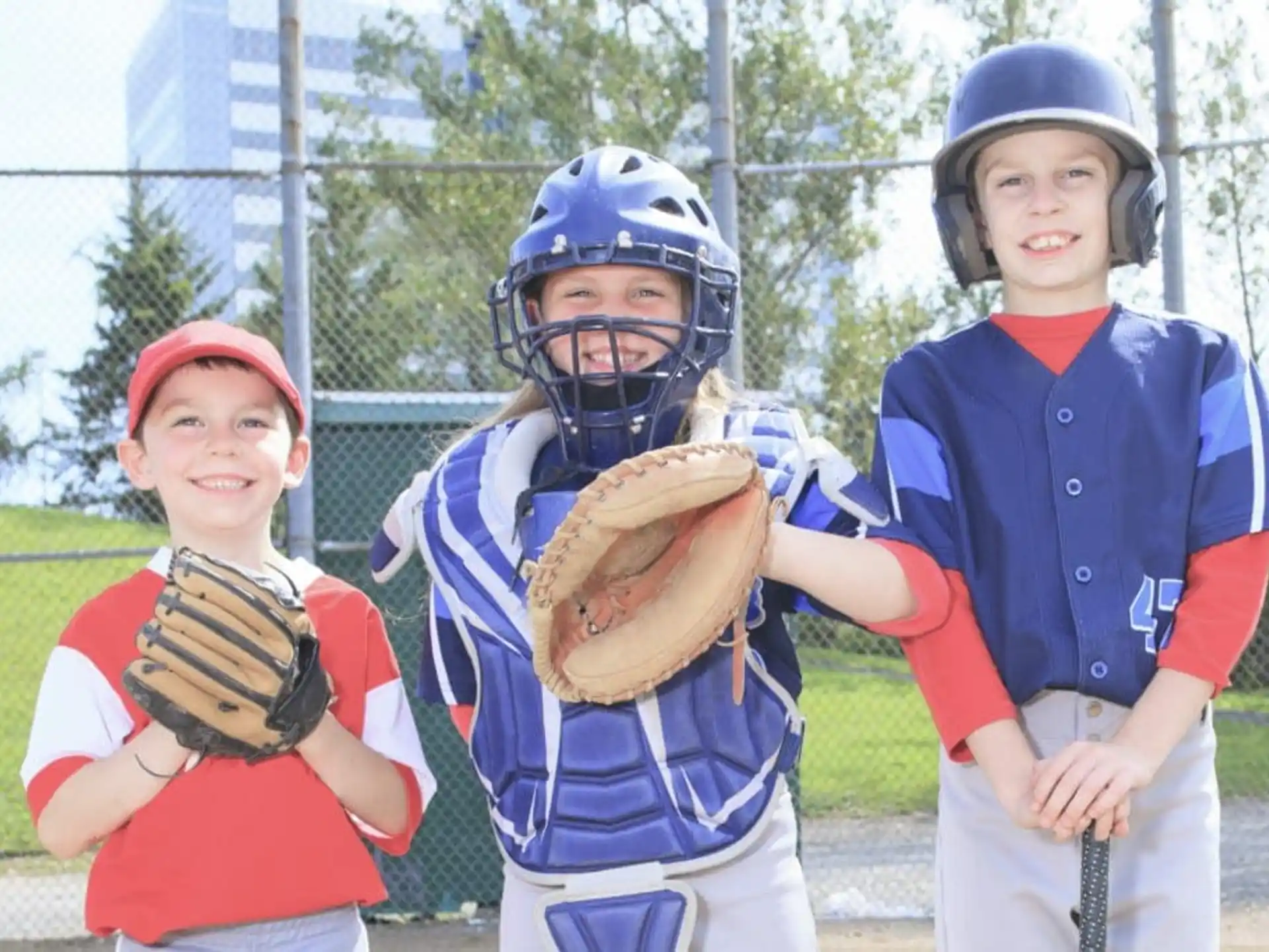 a group of kids wearing baseball uniforms