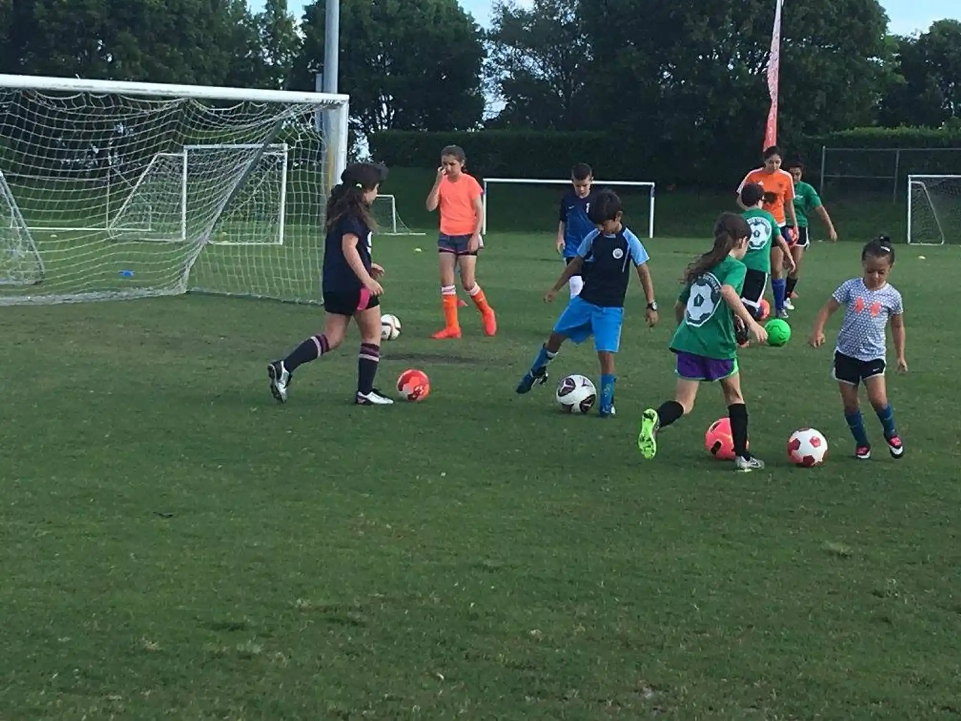 a group of kids playing football