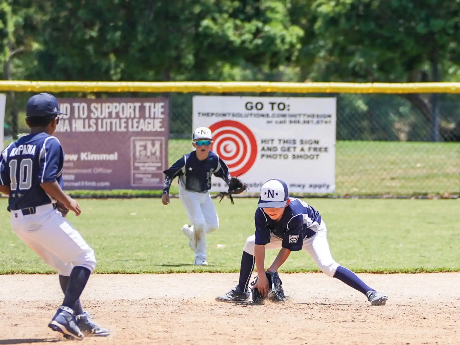 a baseball player sliding into home plate