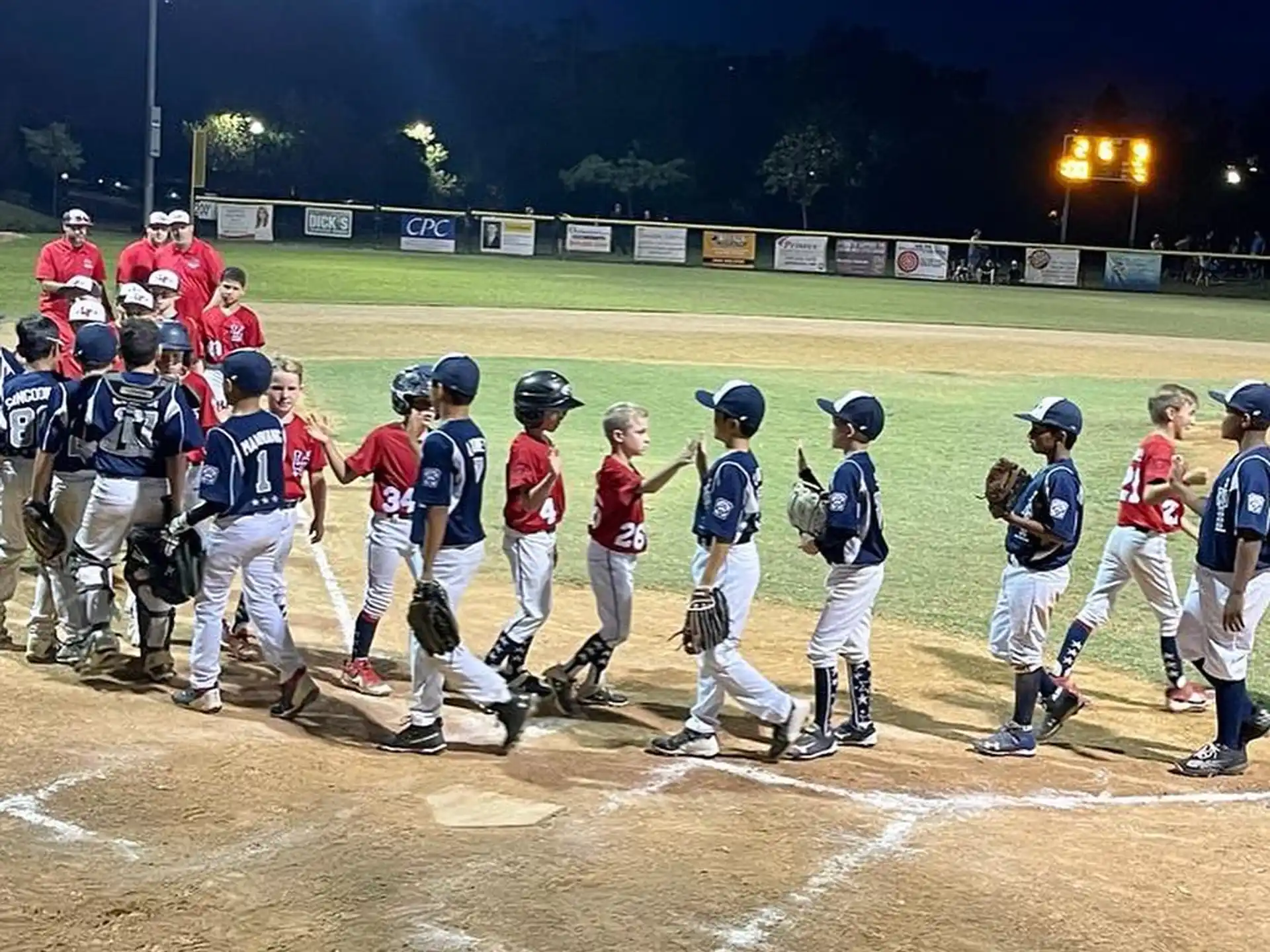 a group of baseball players standing on a field