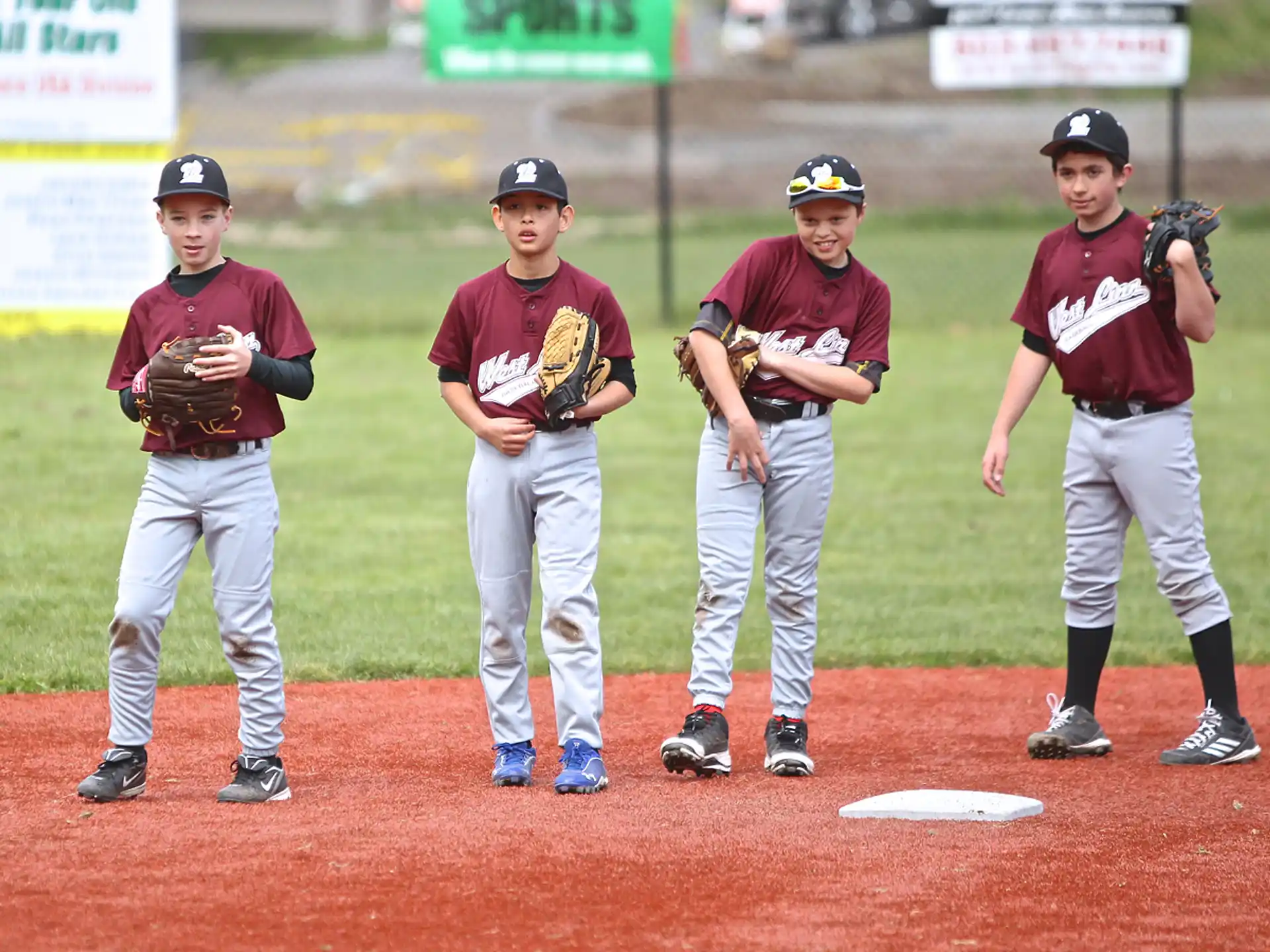 a group of baseball players standing on a field