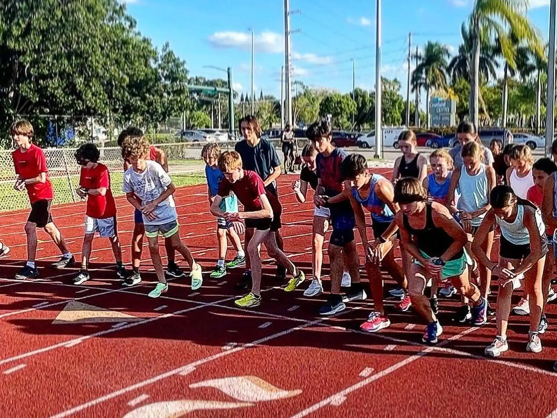 a group of people running on a track