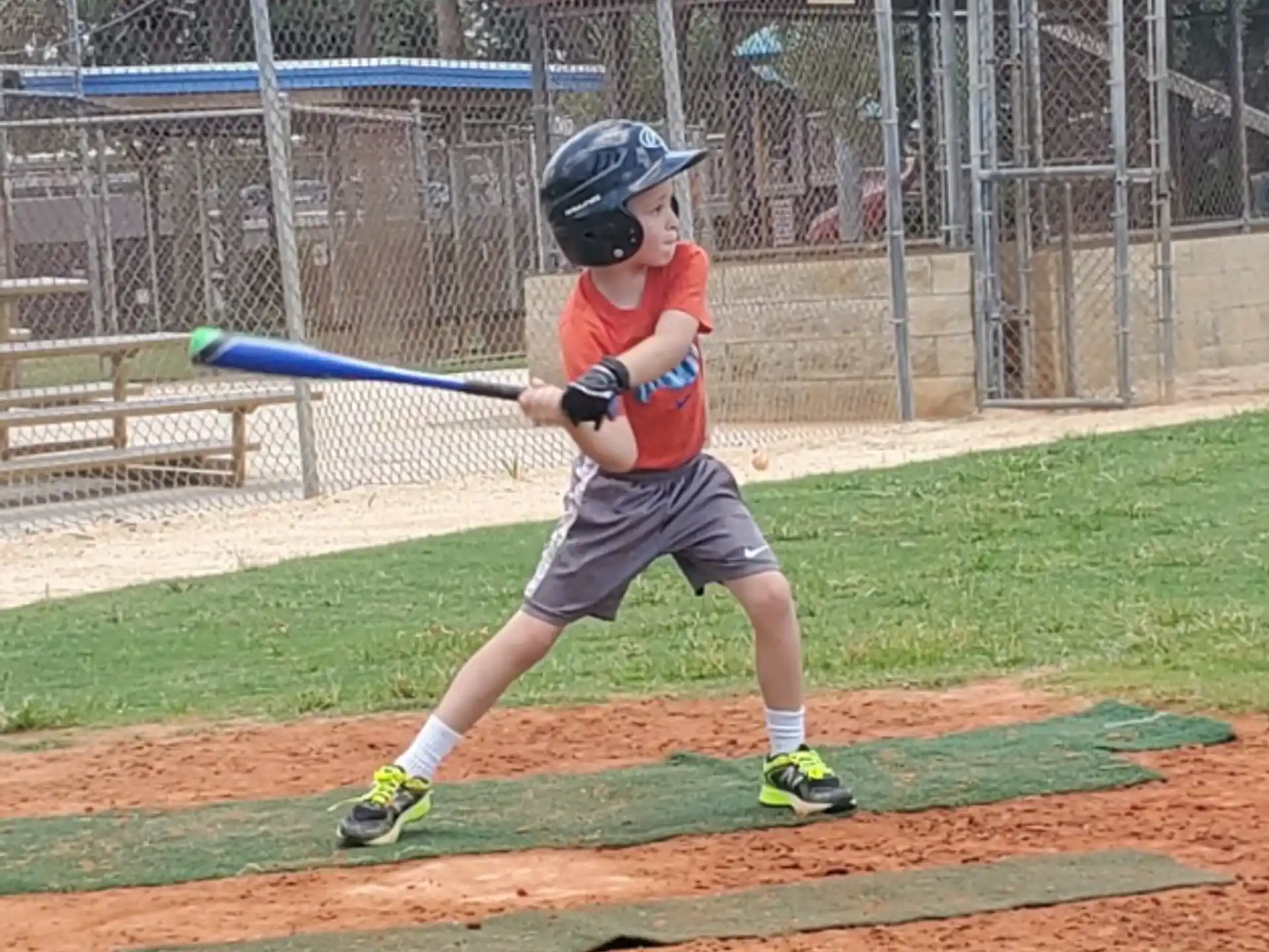 a young boy playing baseball
