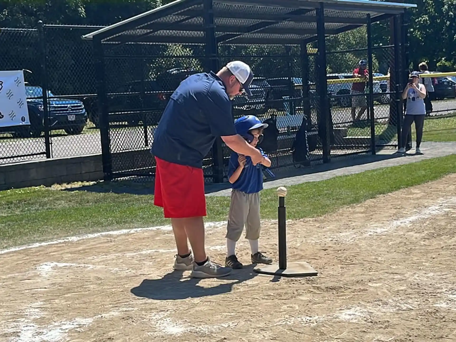 a man and a boy playing baseball