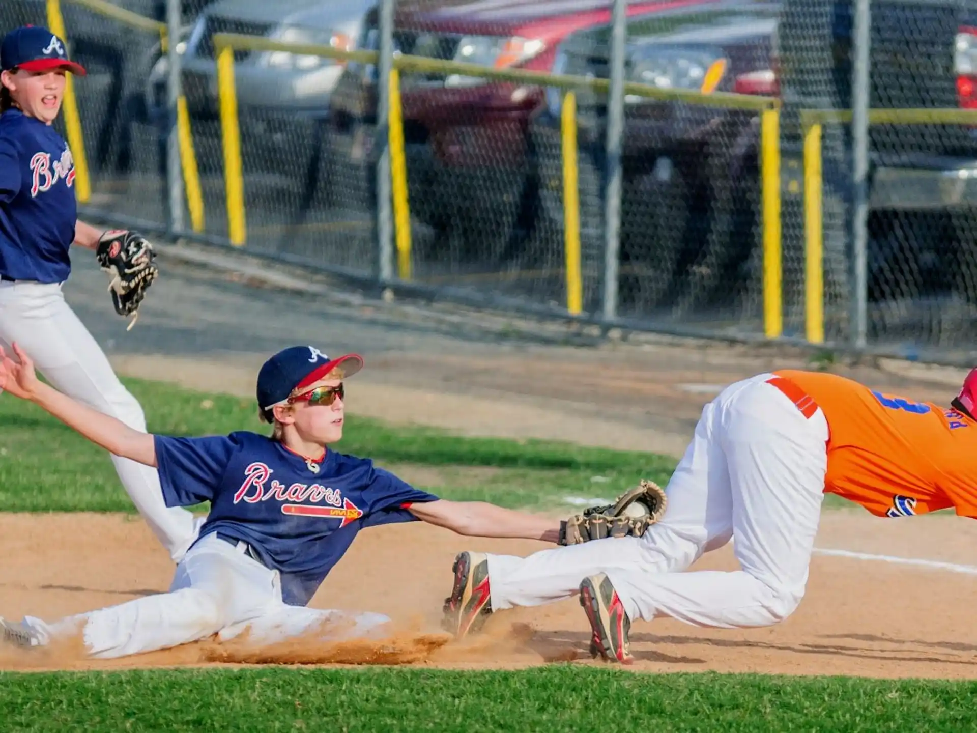 a baseball player sliding into a base