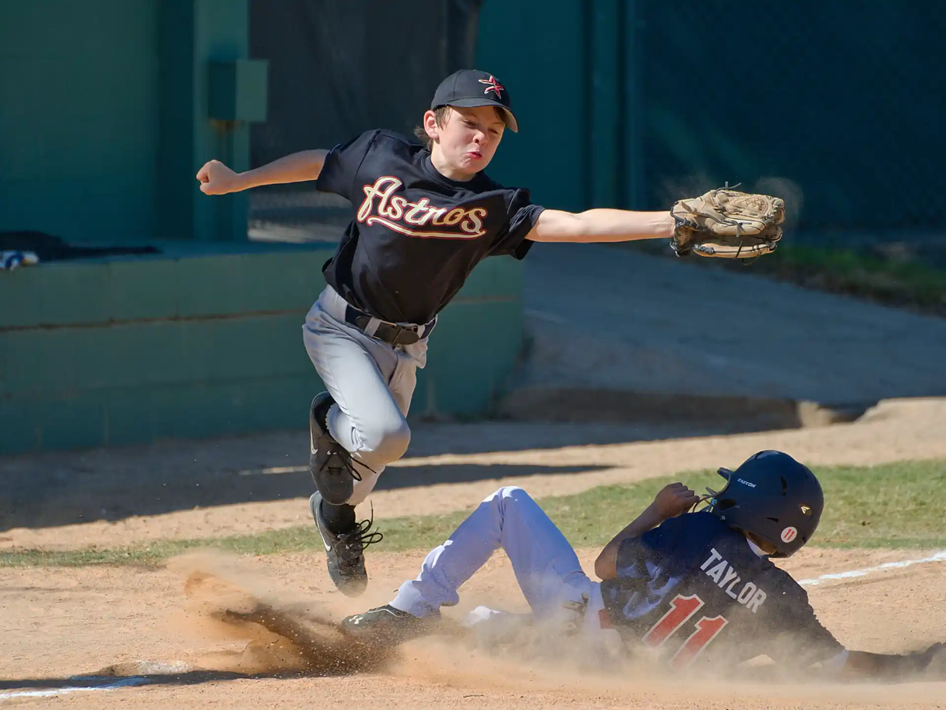 a baseball player sliding into a base