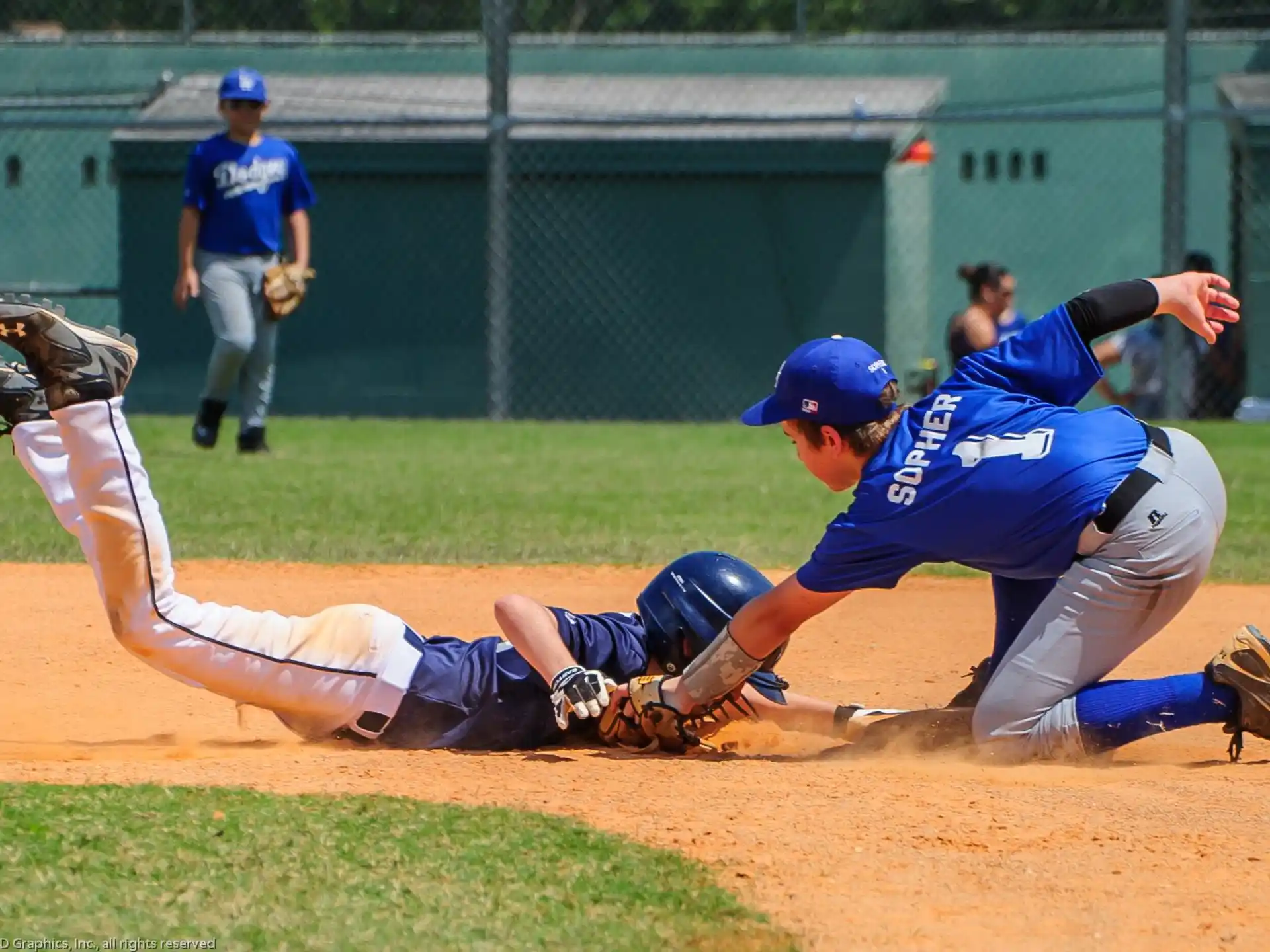 a baseball player sliding into home plate