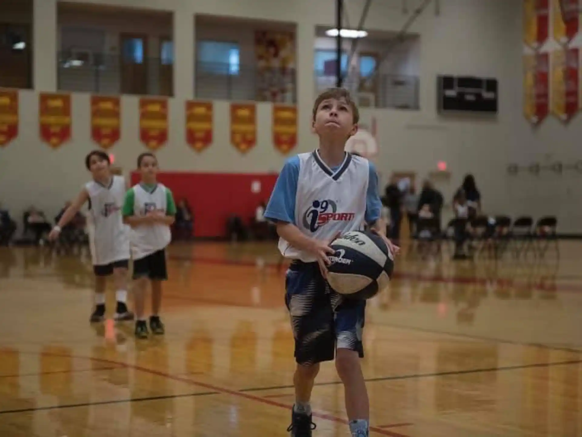 a boy holding a ball