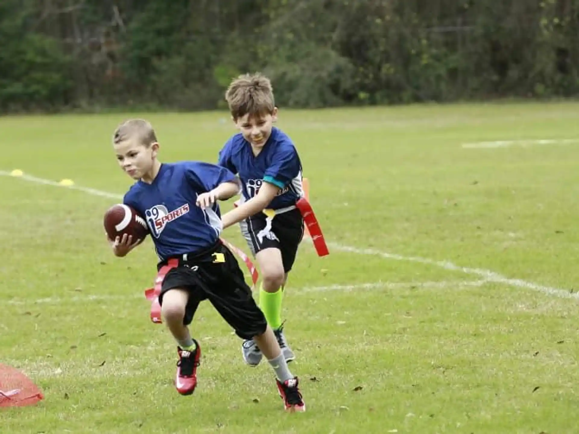 a group of boys playing football