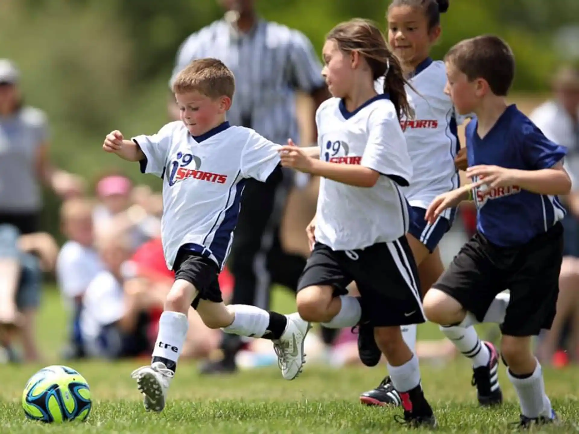 kids playing football on a field