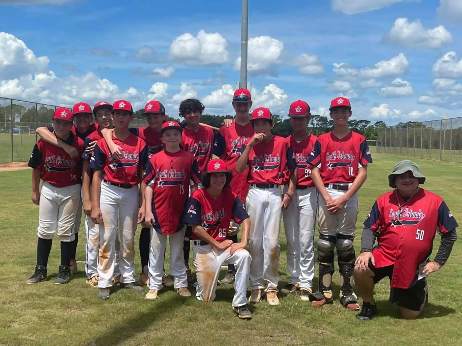 a group of baseball players posing for a photo