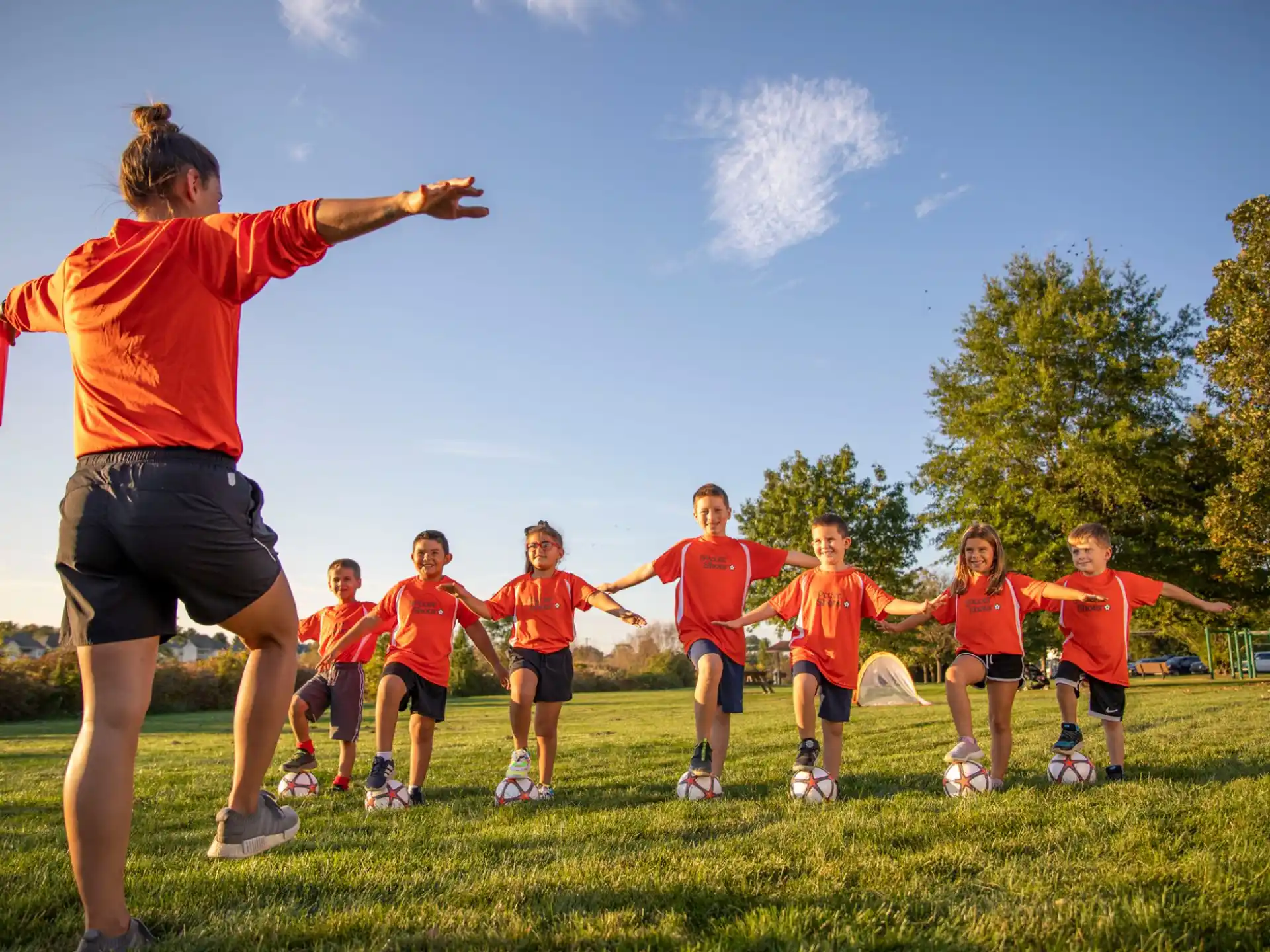a group of kids playing football