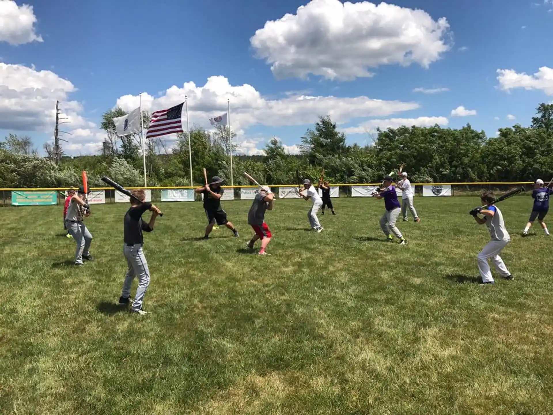 a group of people playing baseball