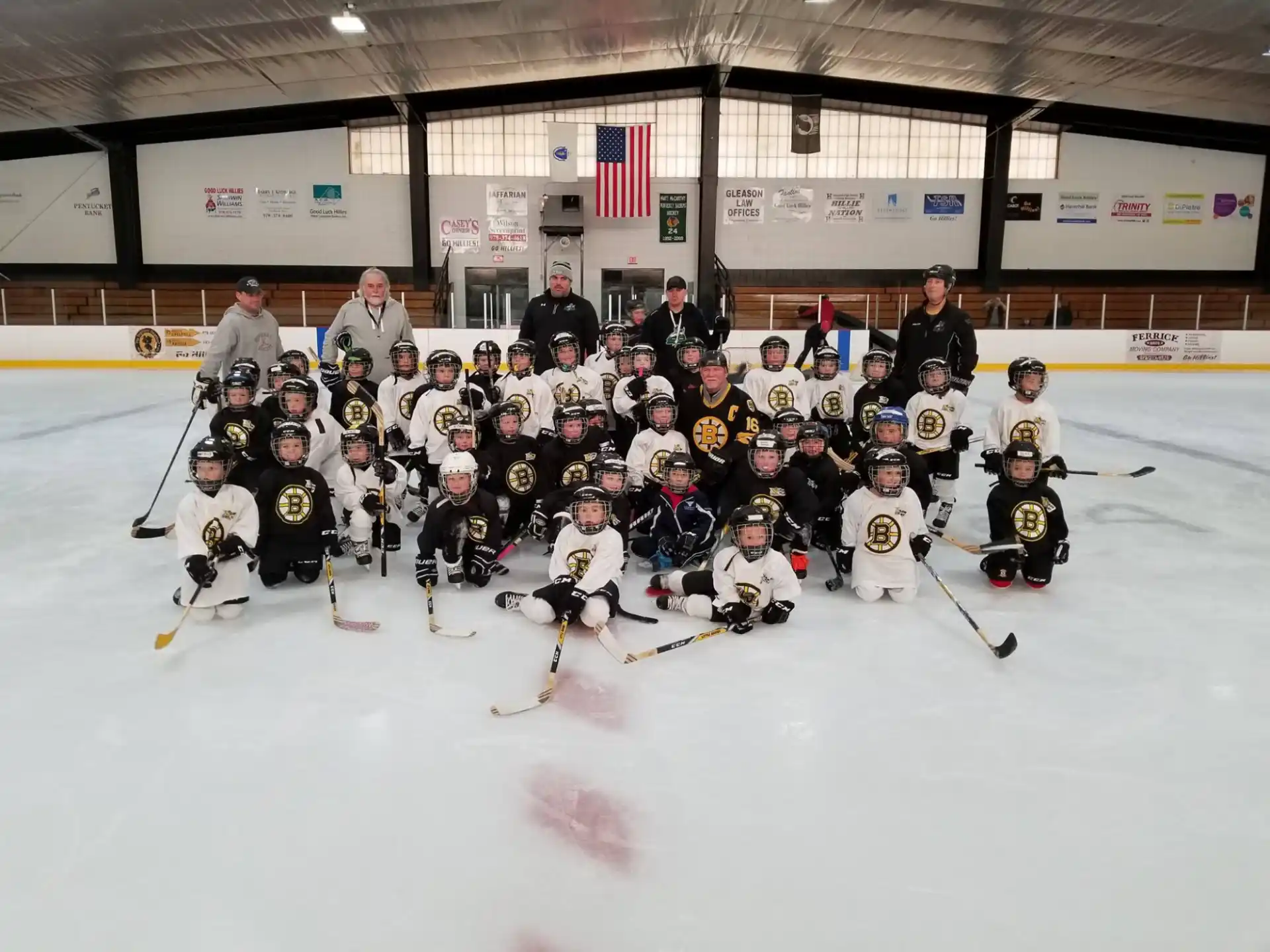 a group of people wearing hockey uniforms and posing for the camera