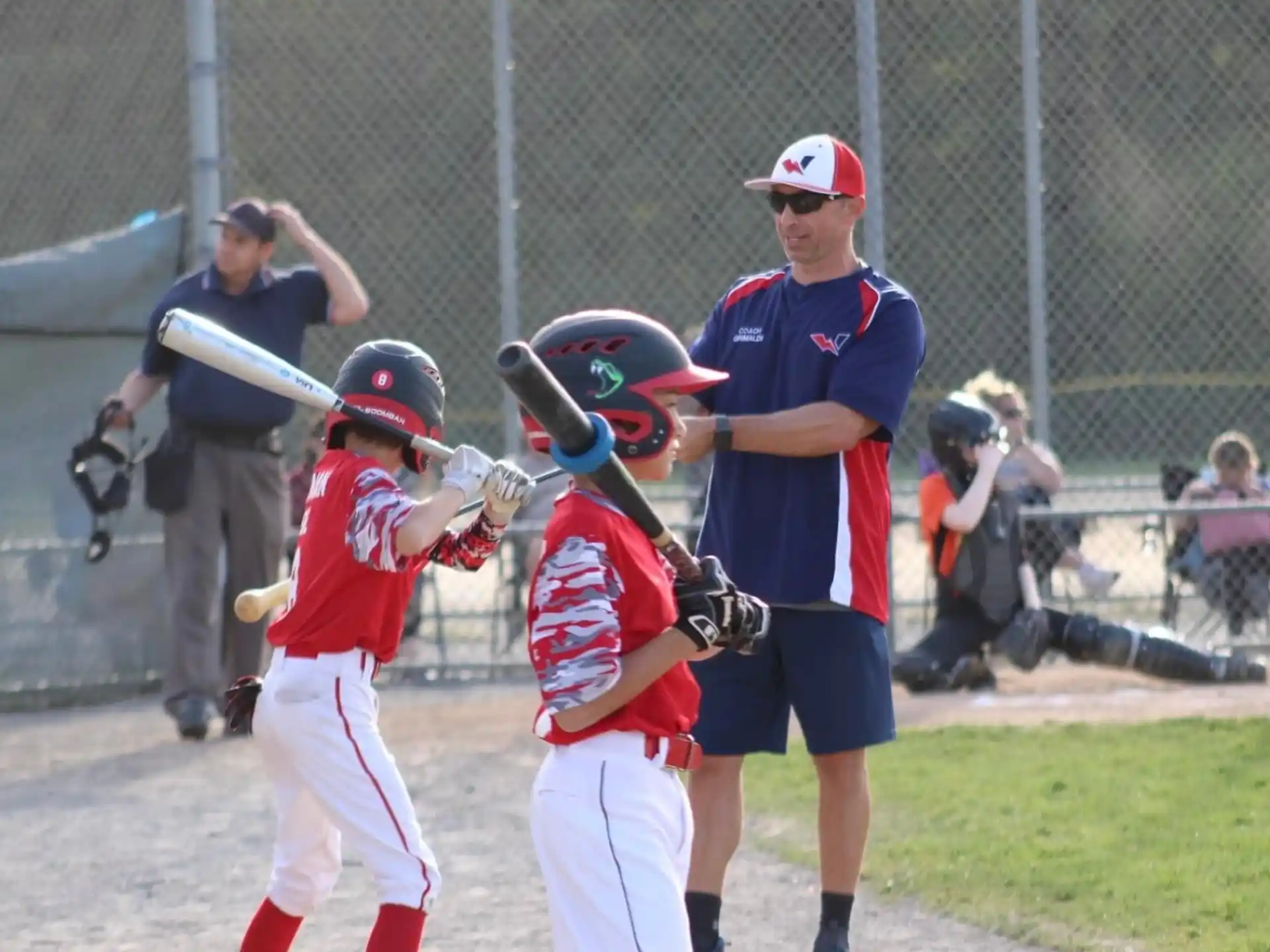 a group of kids playing baseball