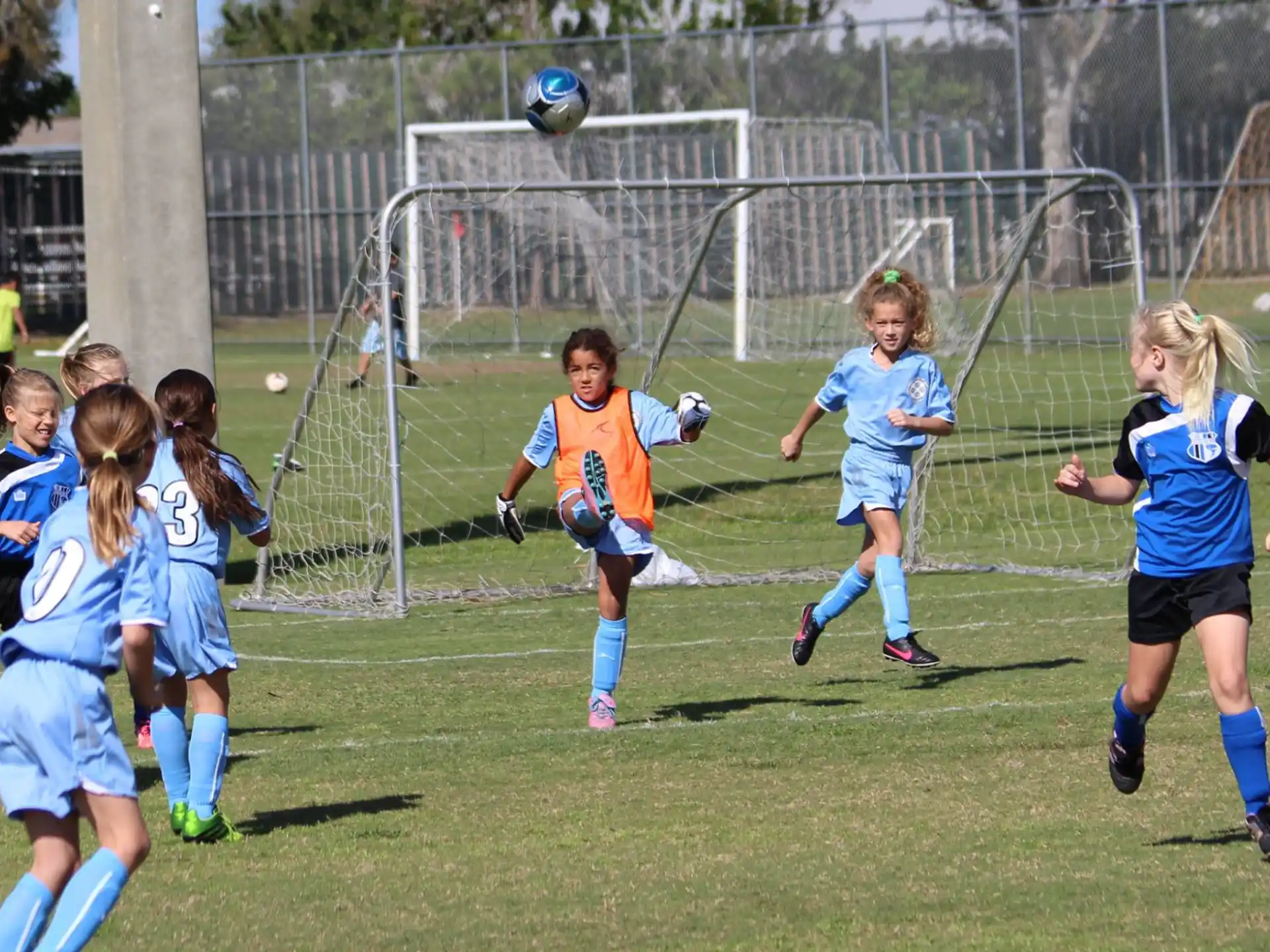 a group of girls playing football
