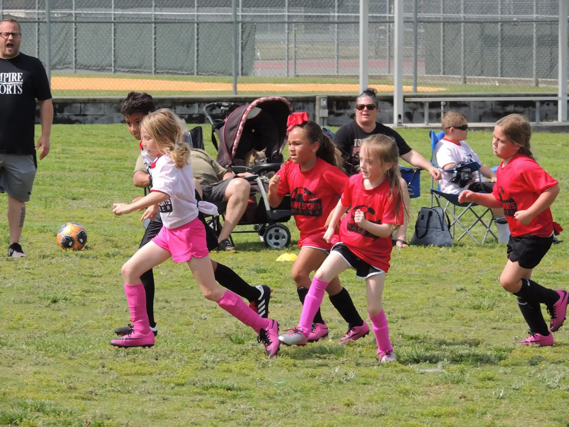 a group of girls playing football
