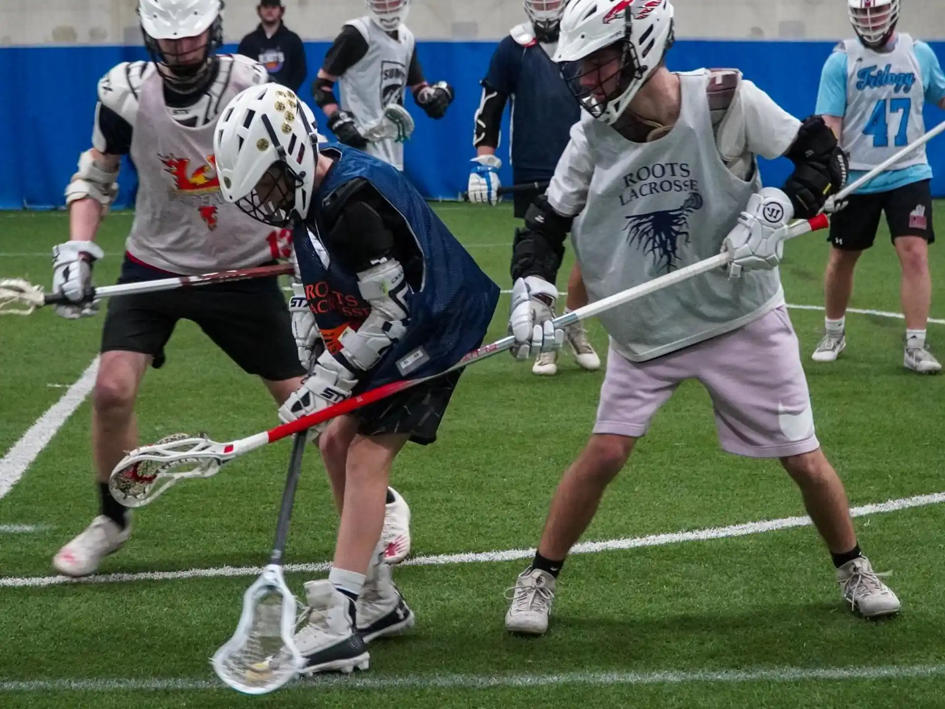 a group of men playing lacrosse