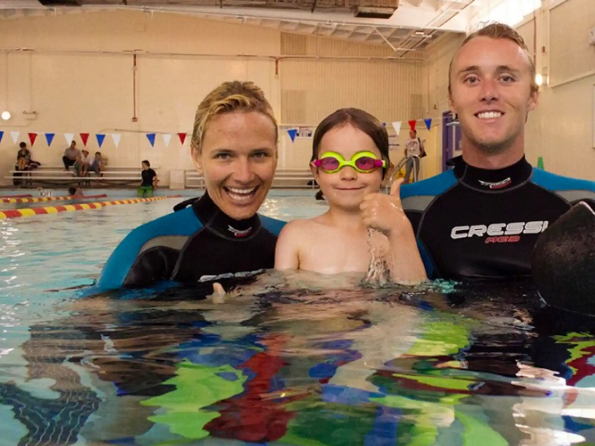 a group of people in a pool