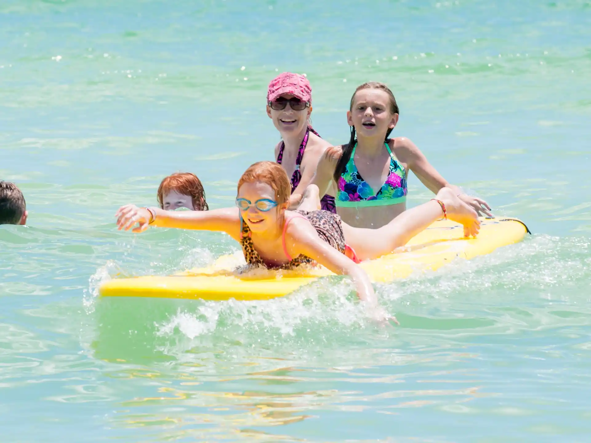 a group of people on a floaty in the water