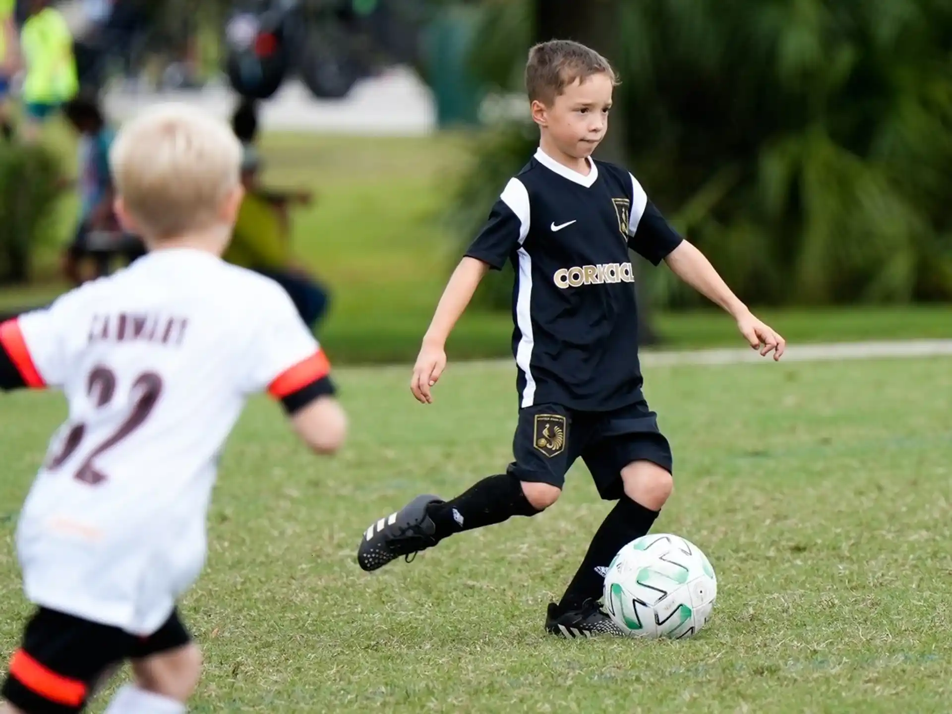 kids playing football on a field