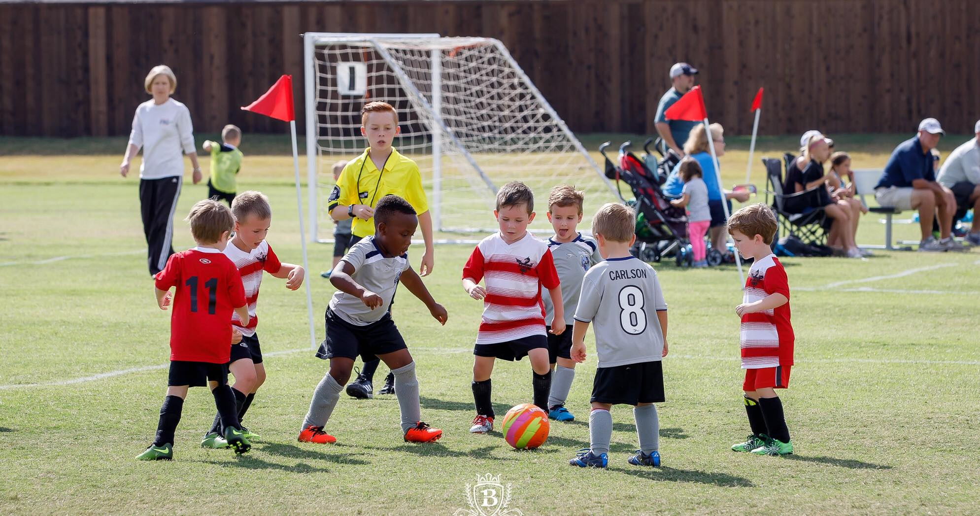 kids playing football on a field