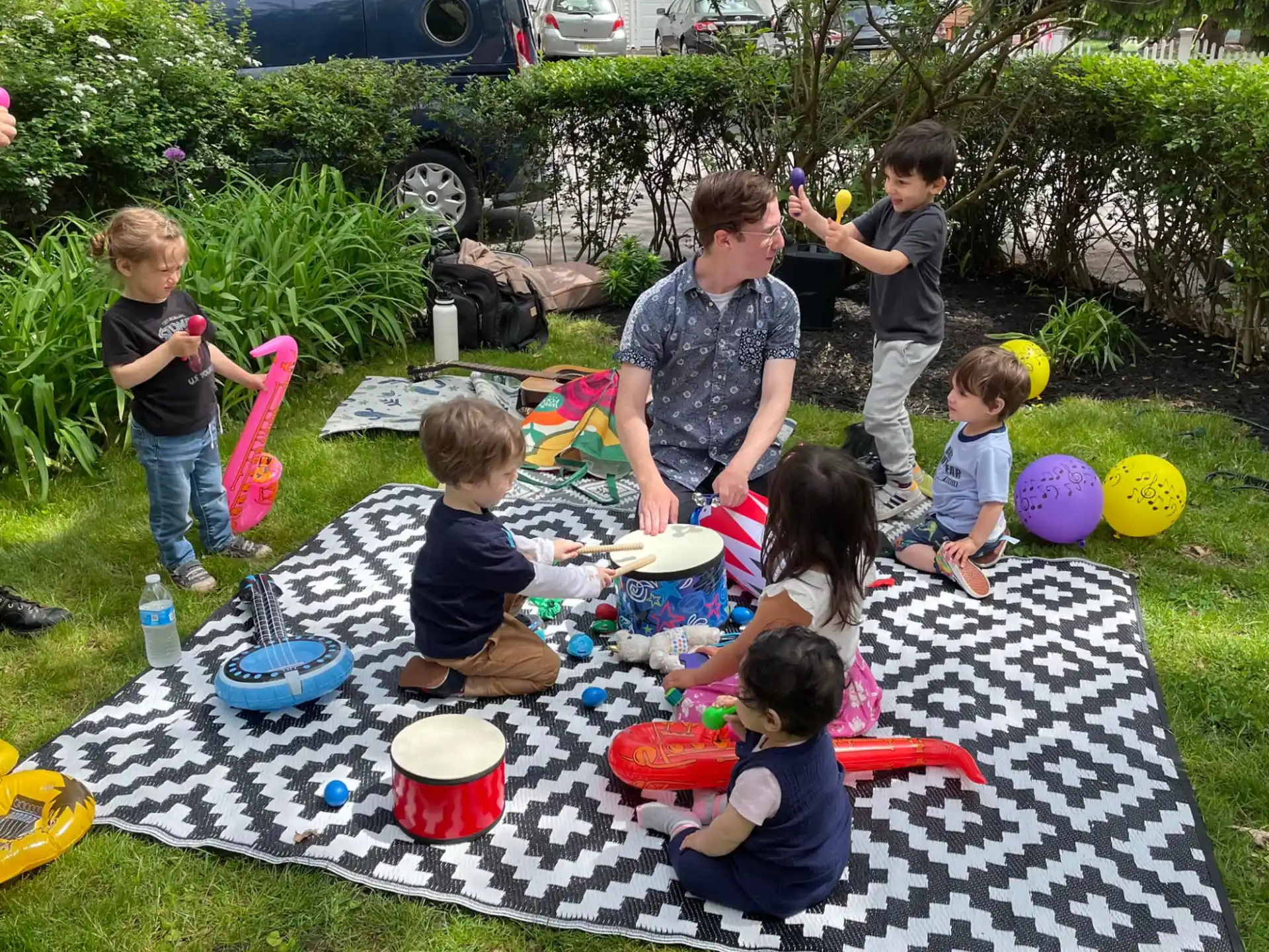 a group of kids playing in the grass