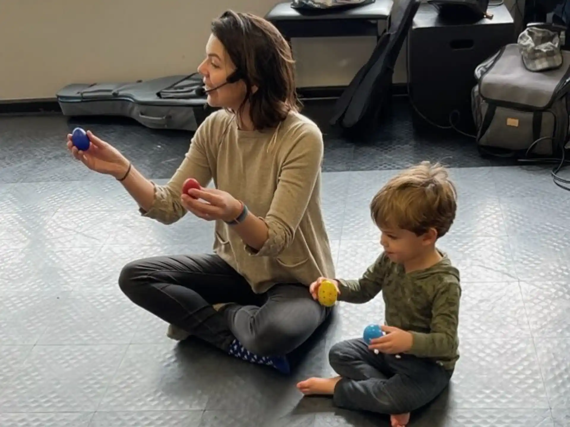 a person and a child playing with toys
