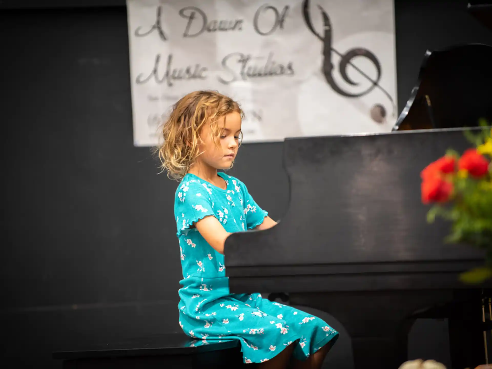 a person sitting on a piano