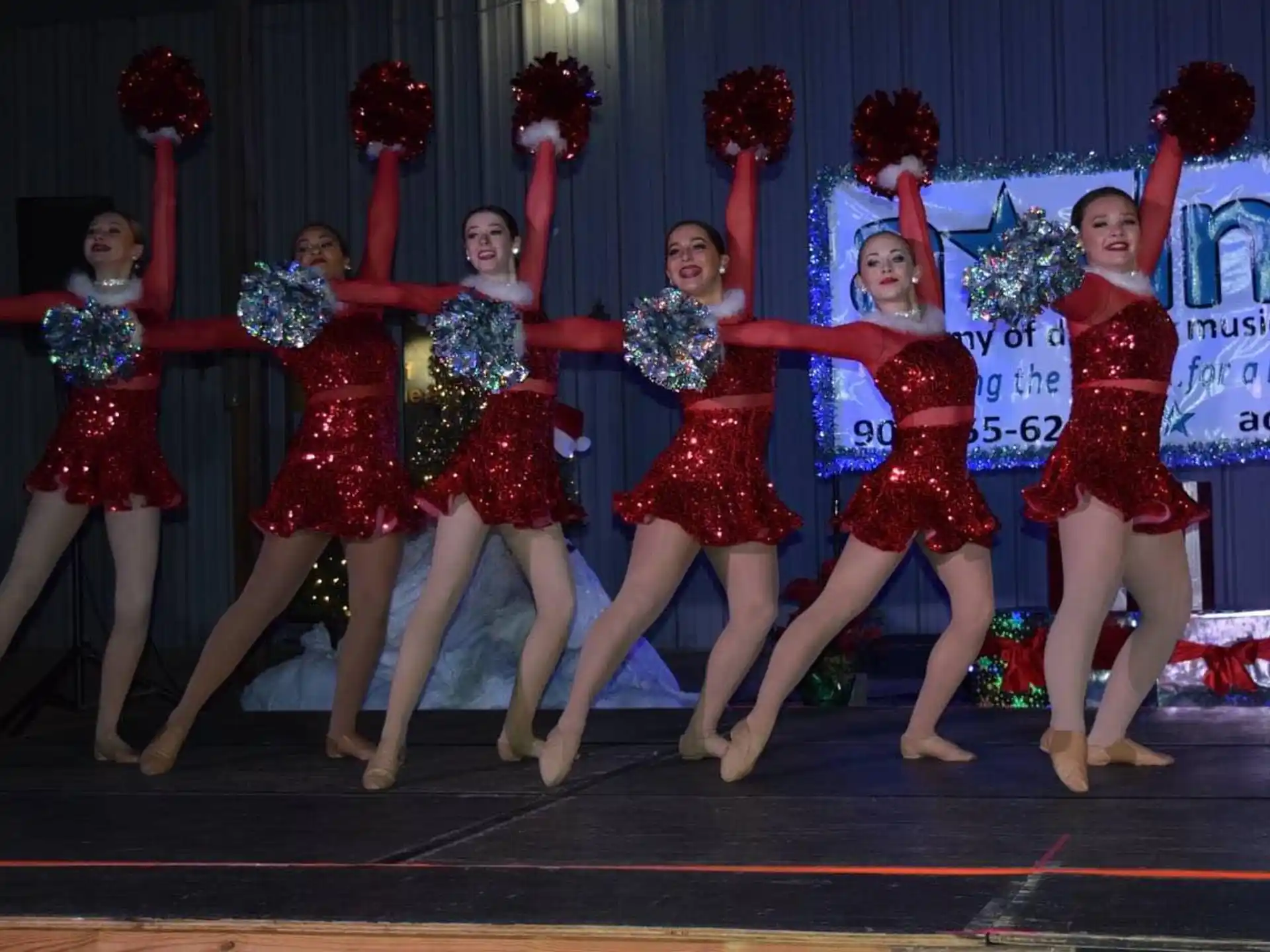 a group of women dancing on a stage