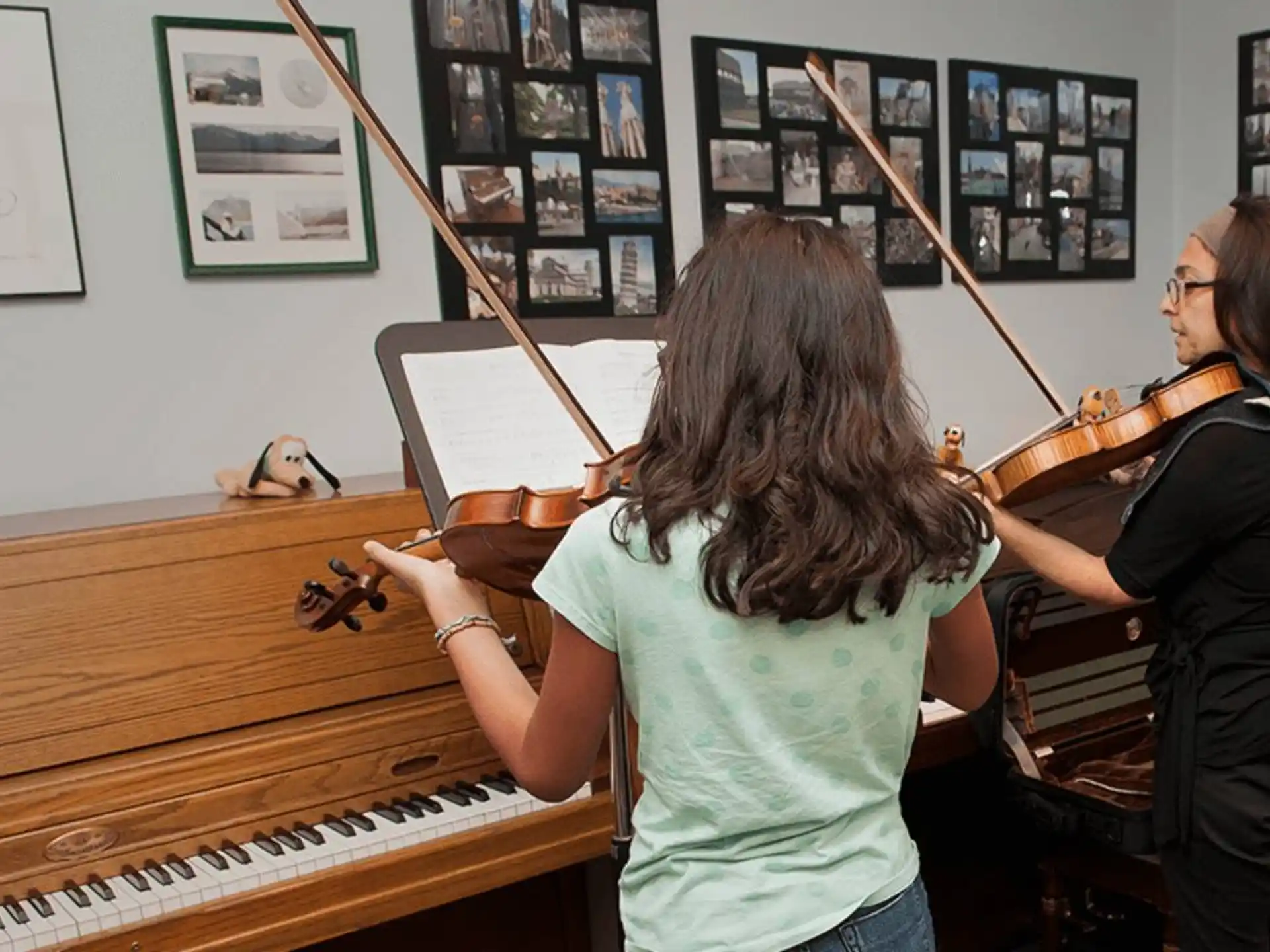 a woman playing a violin