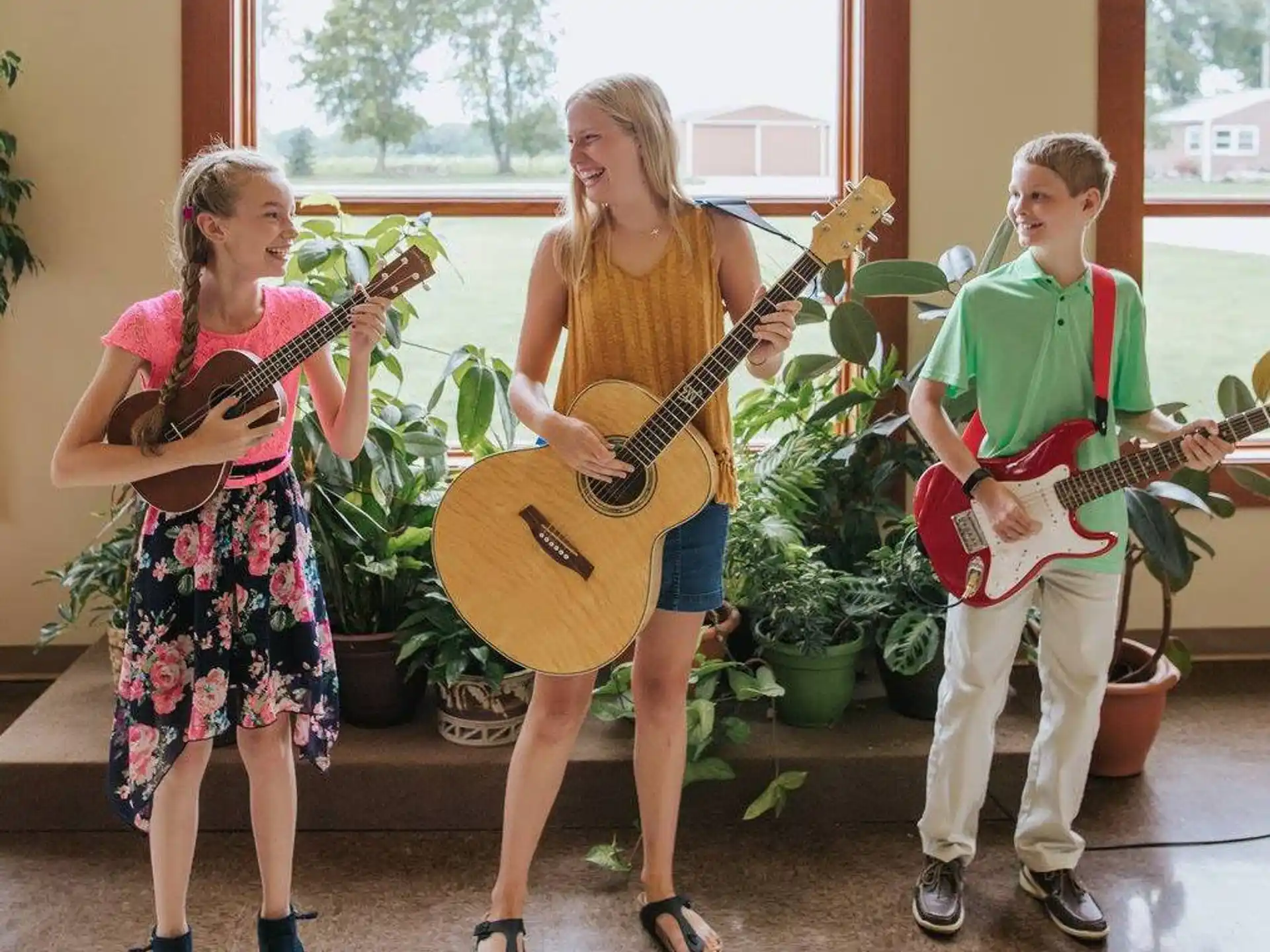 a group of people holding guitars