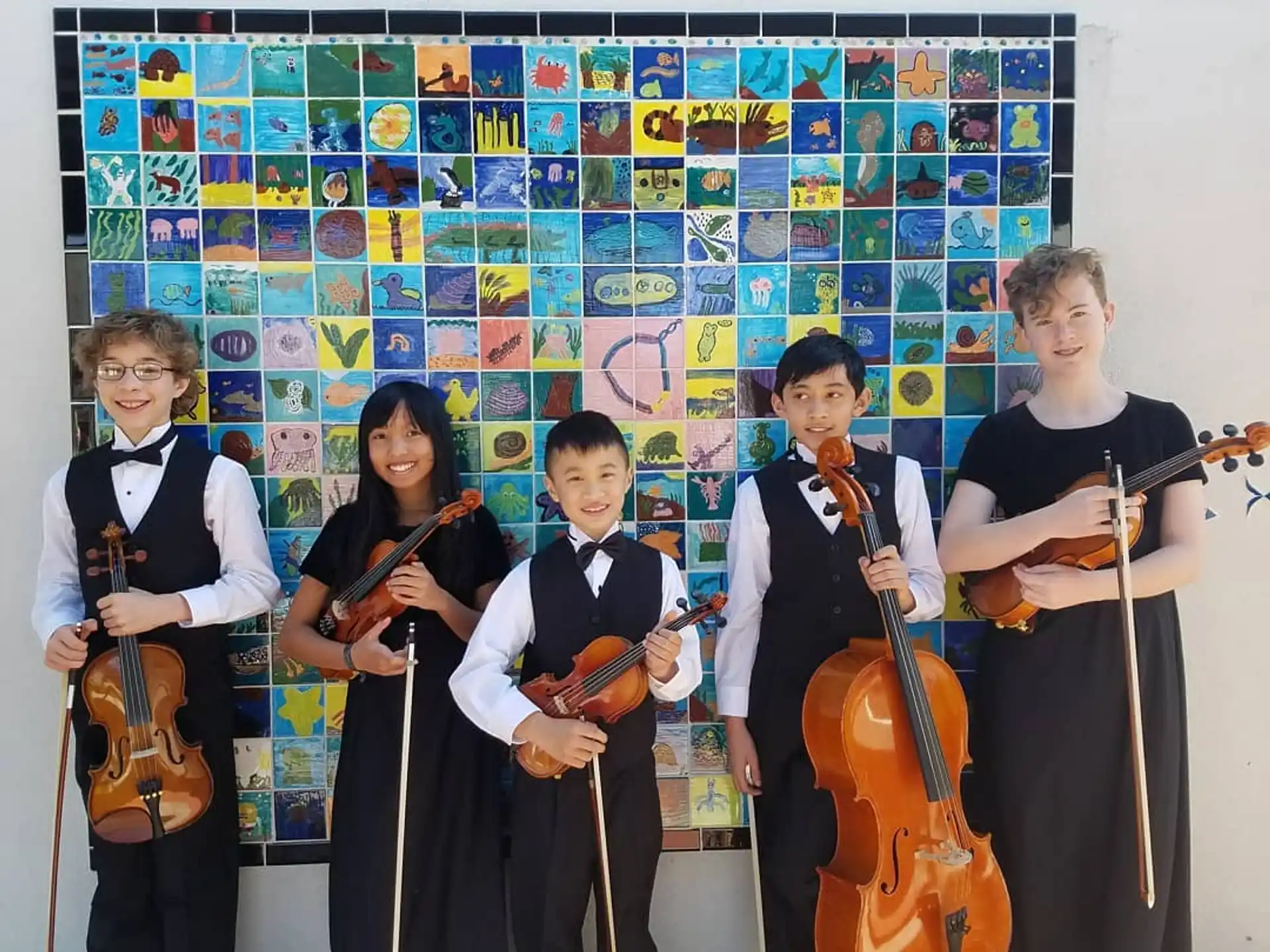 a group of people holding musical instruments