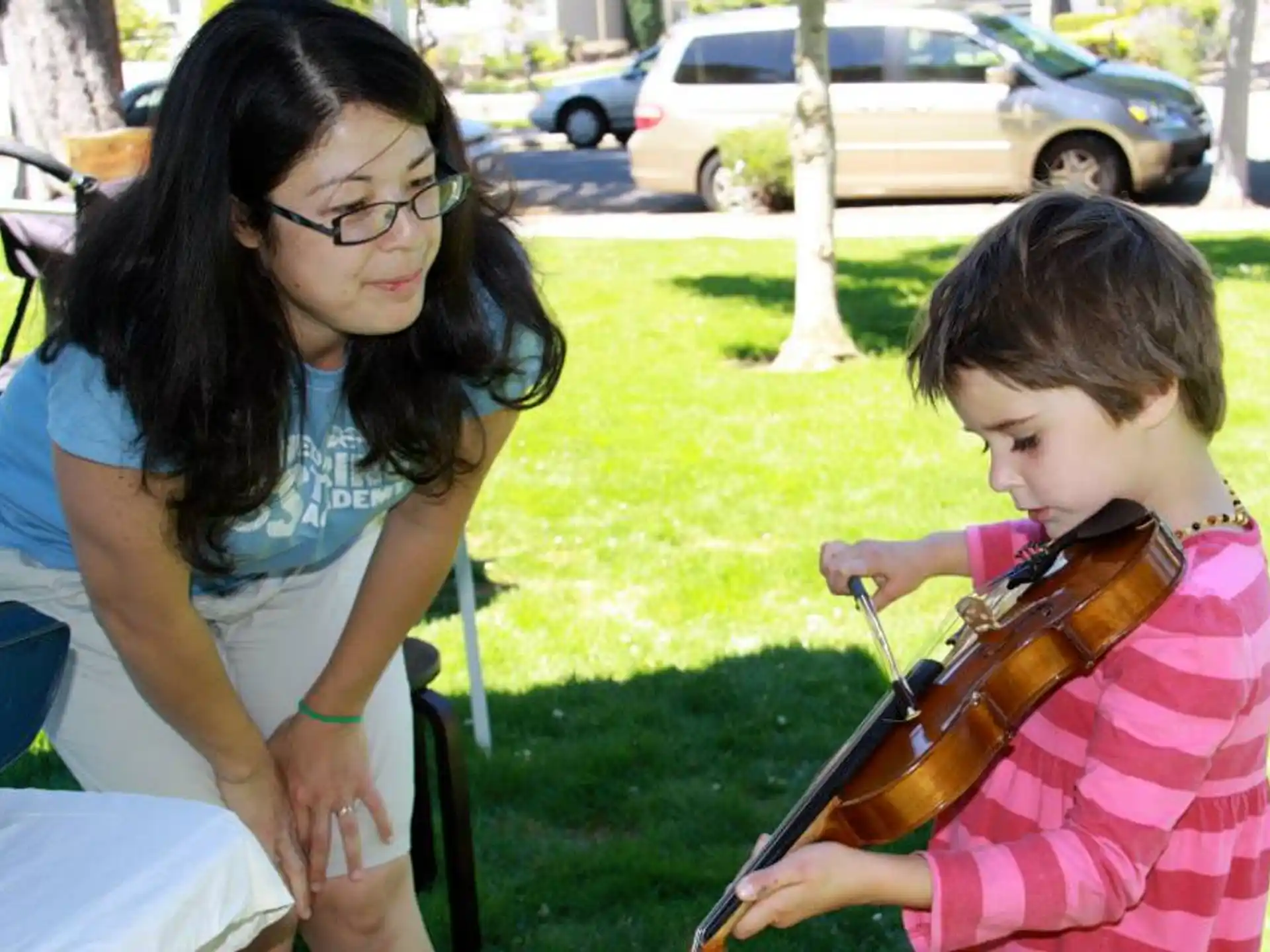 a woman and a child sitting outside
