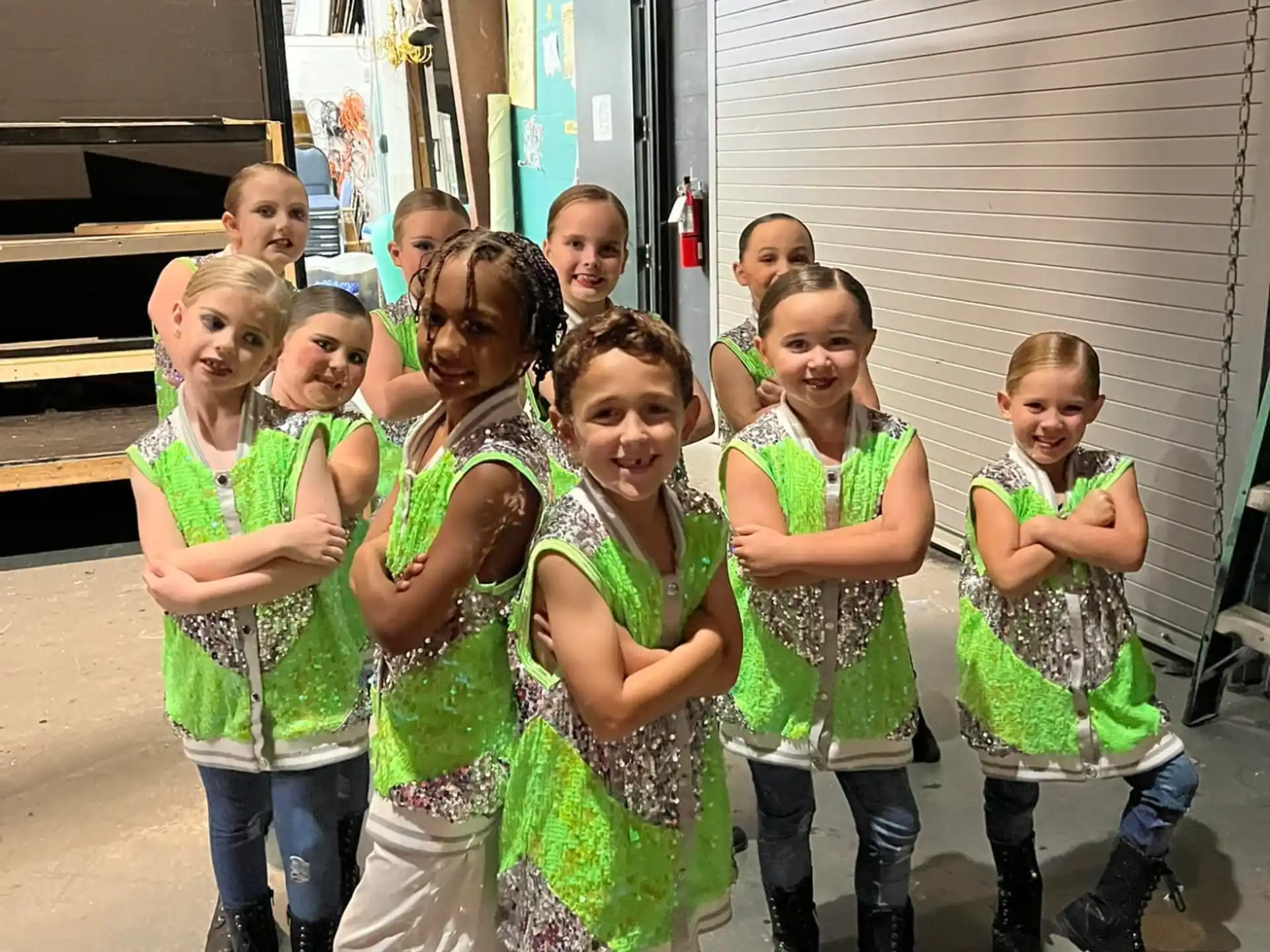 a group of girls in green uniforms