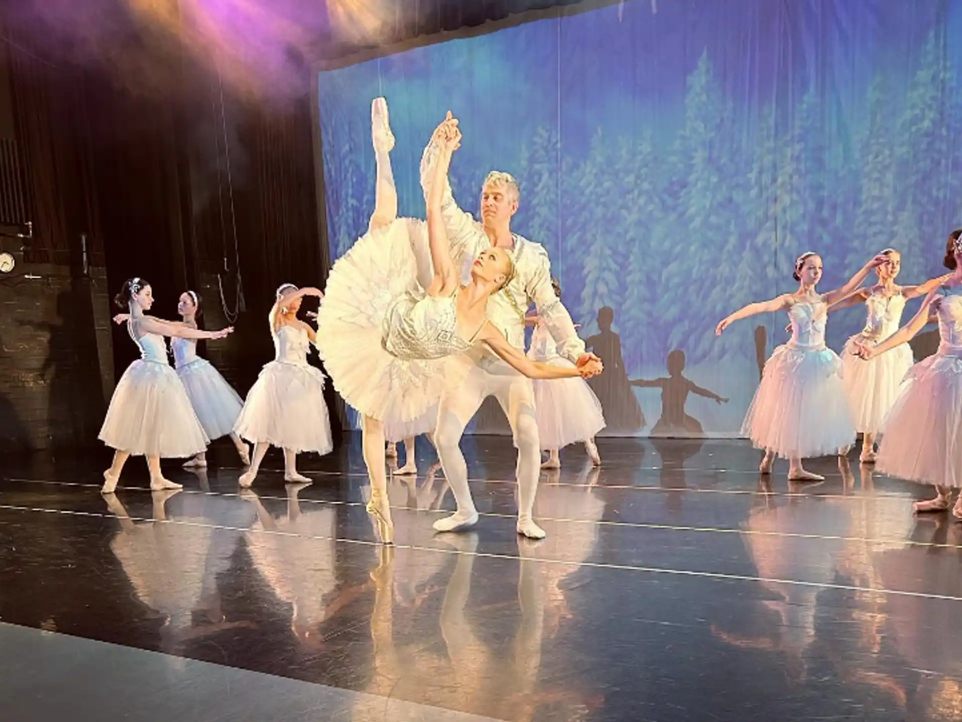 a group of people dancing on a stage