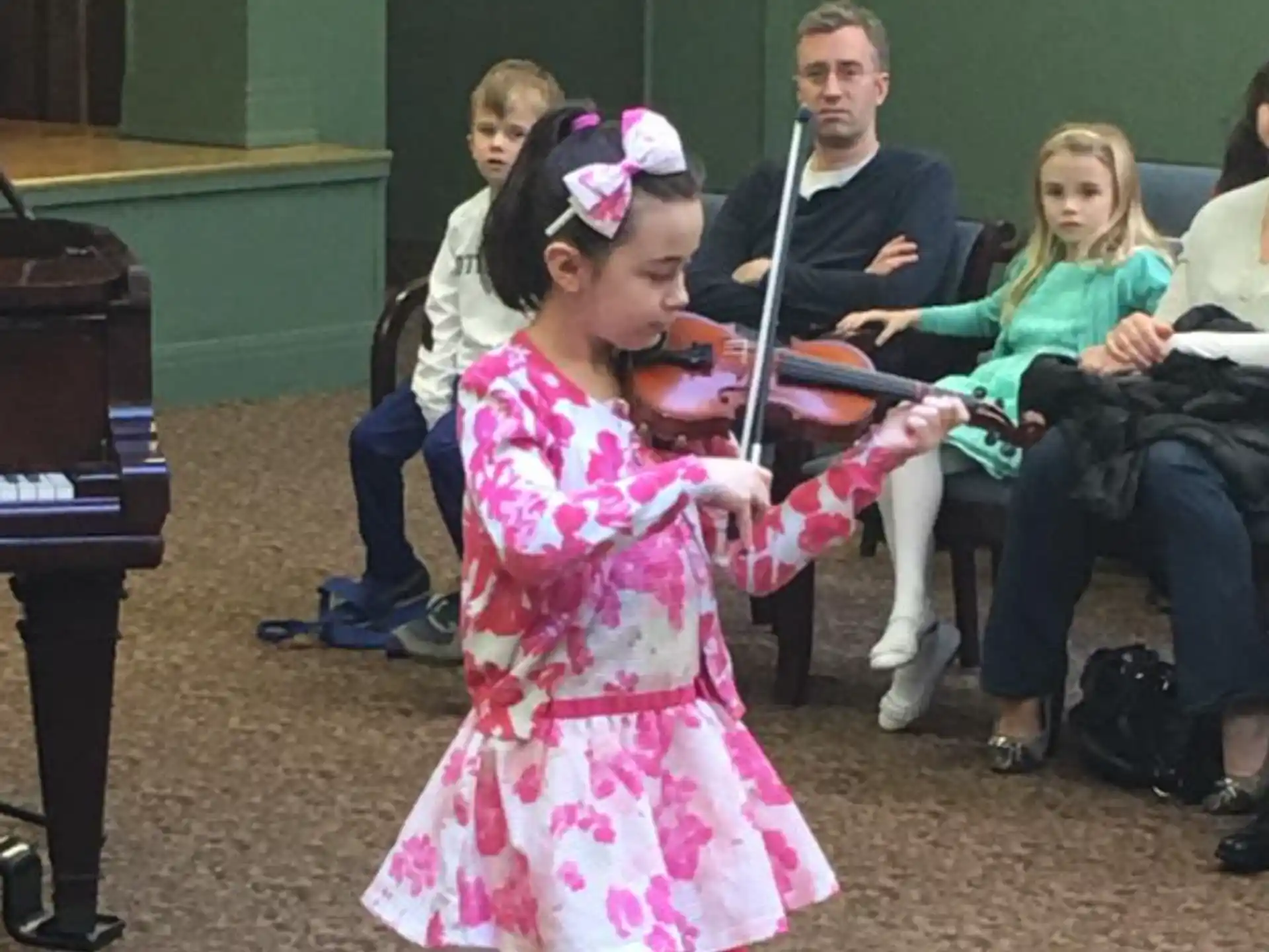 a girl playing a violin