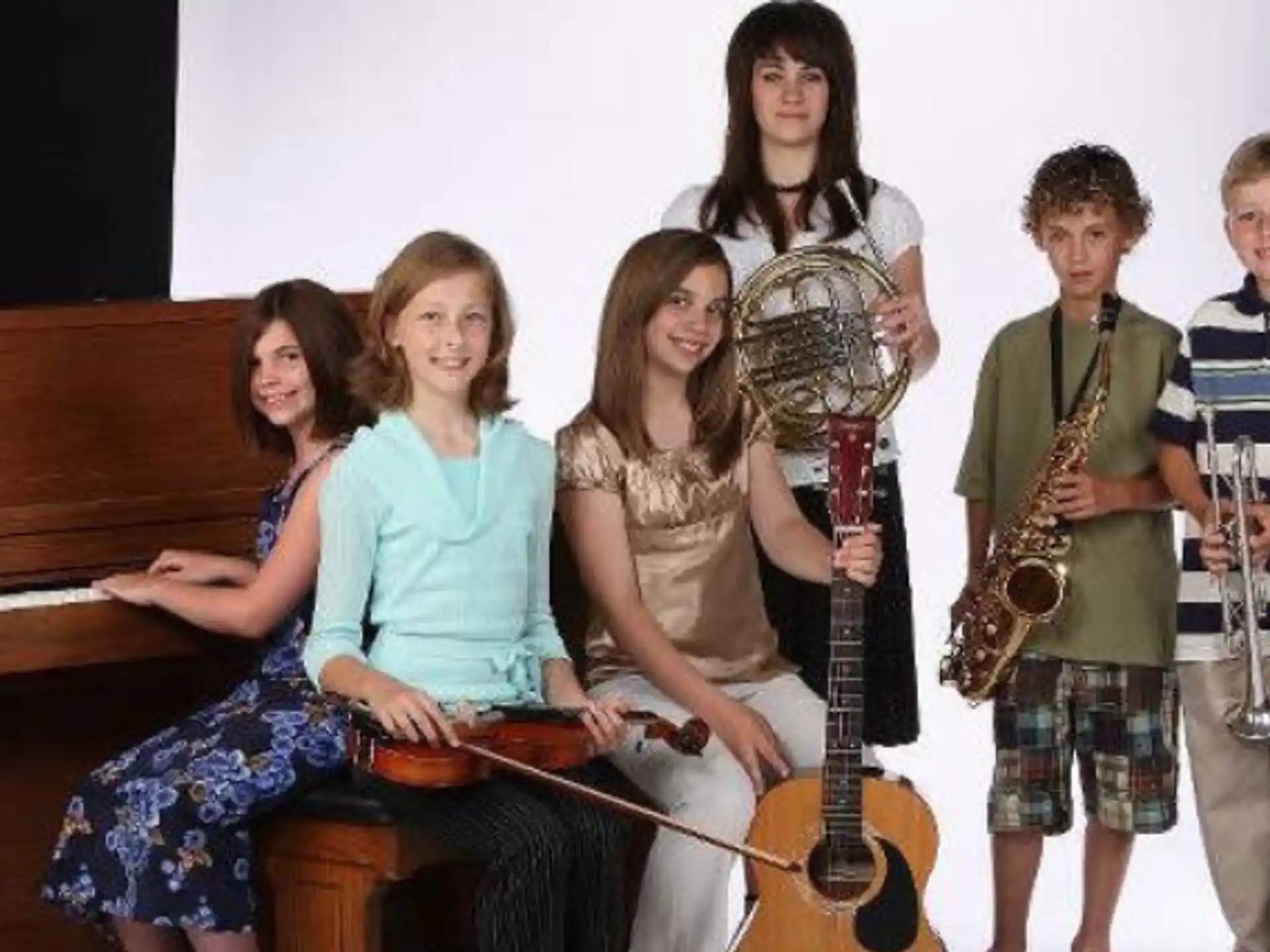 a group of people holding musical instruments