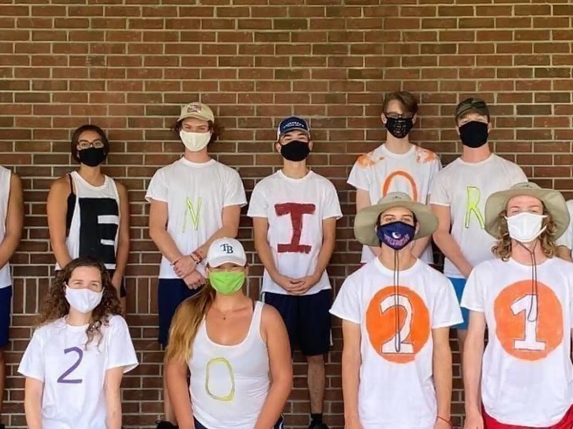 a group of people wearing masks