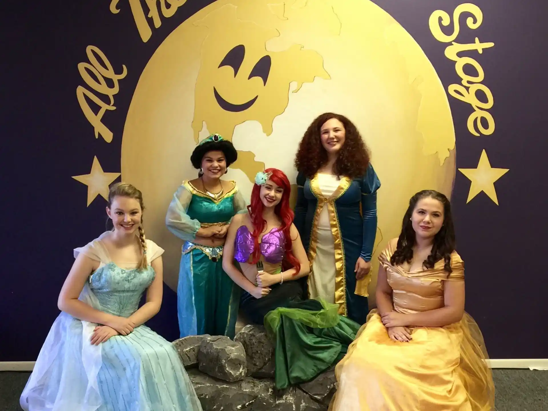 a group of women in dresses