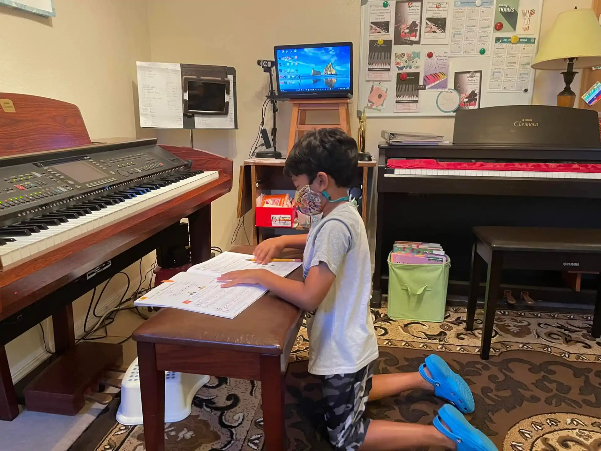 a boy playing a piano