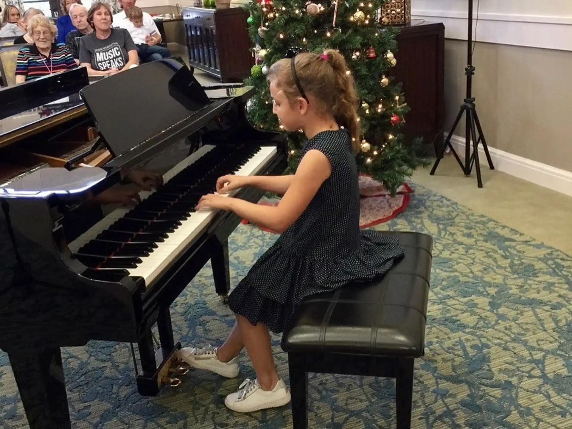 a girl playing a piano